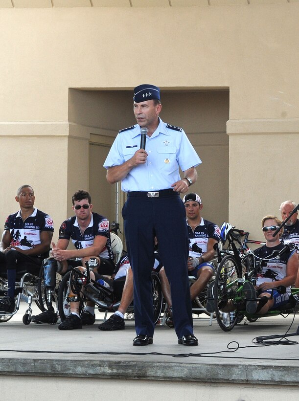 LANGLEY AIR FORCE BASE, Va. – Lt. Gen. William J. Rew, Air Combat Command vice commander, address the Sea to Shining Sea riders after their arrival in Virginia Beach July 24. Sea to Shining Sea is a 4000 mile bike ride which started at the Golden Gate Bridge and ended in Virginia Beach and includes injured military and a few able-bodied cyclists honoring the courage of our military and the strength of the American spirit.. (U.S. Air Force Photo/Staff Sgt. Christina M. Styer)
