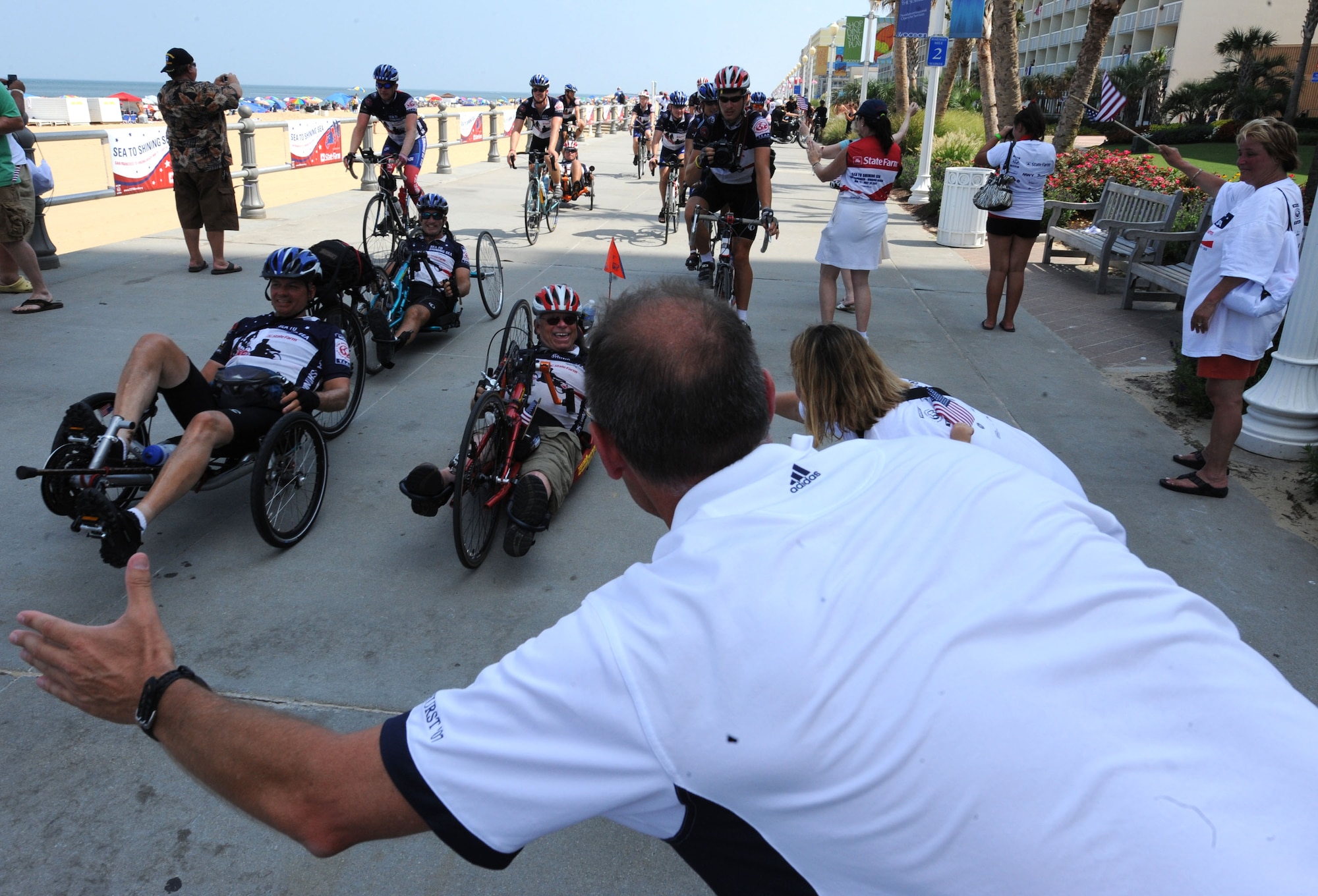 LANGLEY AIR FORCE BASE, Va. -- Sea to Shining Sea riders arrive in Virginia Beach July 24 to a crowd of family members and local supporters. Sea to Shining Sea is a 4000 mile bike ride which started at the Golden Gate Bridge and ended in Virginia Beach and includes injured military and a few able-bodied cyclists honoring the courage of our military and the strength of the American spirit.. (U.S. Air Force Photo/Staff Sgt. Christina M. Styer)