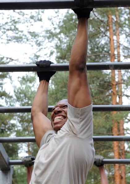 U.S. Air Force Staff Sgt. Donald Herring, 8th Air Support Operations Squadron commander support, Aviano Air Base, Italy, attempts to complete an obstacle during exercise Allied Strike 10, Grafenwoehr, Germany, July 23, 2010. Allied Strike is Europe's premier close air support (CAS) exercise, held annually to conduct robust, realistic CAS training that helps build partnership capacity among allied North Atlantic Treaty Organization nations and joint services while refining the latest operational CAS tactics. For more ALLIED STRIKE information go to www.usafe.af.mil/alliedstrike.asp. (U.S. Air Force photo by Senior Airman Caleb Pierce)