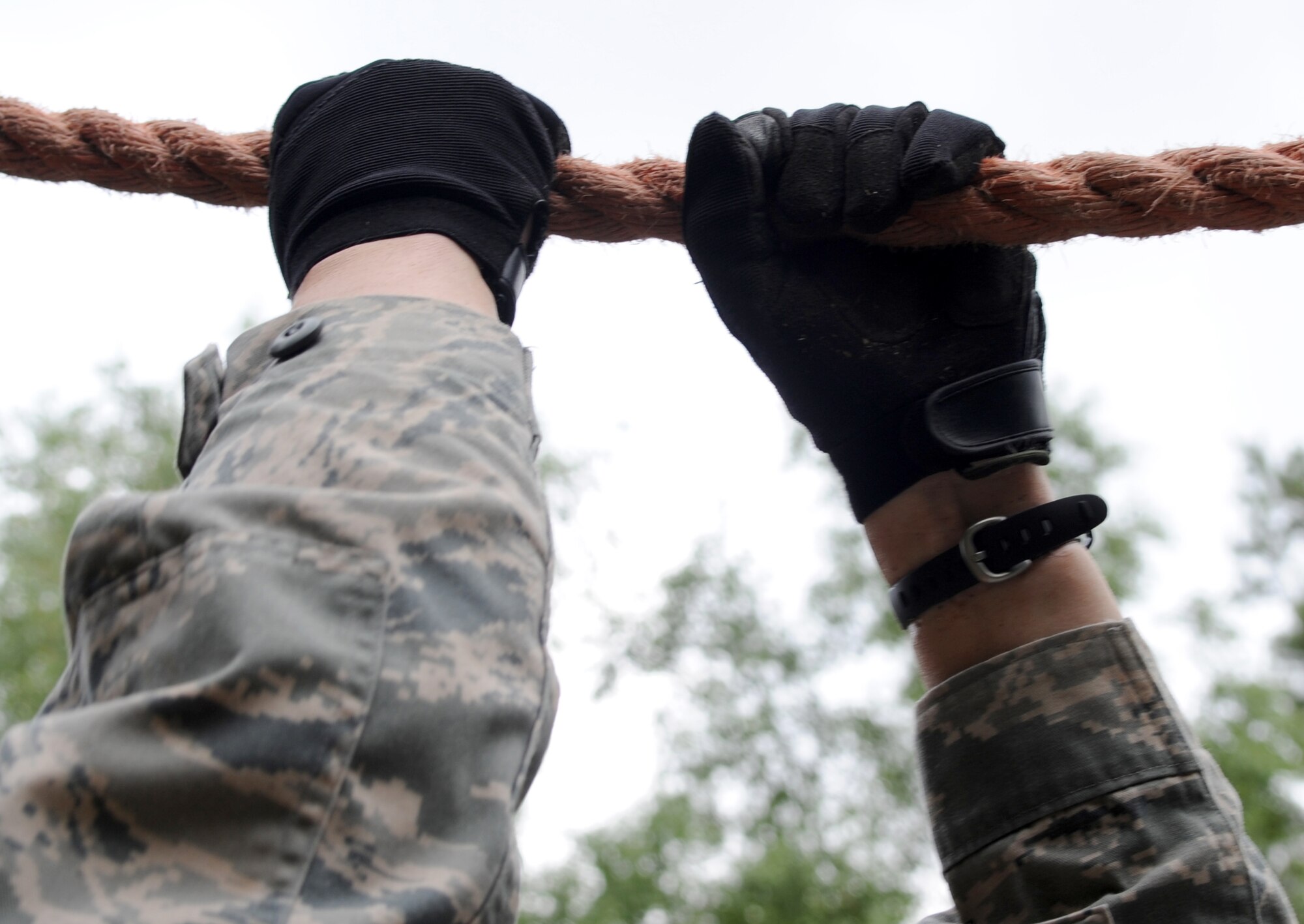 A U.S. Air Force Airman attempts to complete an obstacle during exercise Allied Strike 10, Grafenwoehr, Germany, July 23, 2010. Allied Strike is Europe's premier close air support (CAS) exercise, held annually to conduct robust, realistic CAS training that helps build partnership capacity among allied North Atlantic Treaty Organization nations and joint services while refining the latest operational CAS tactics. For more ALLIED STRIKE information go to www.usafe.af.mil/alliedstrike.asp. (U.S. Air Force photo by Senior Airman Caleb Pierce)