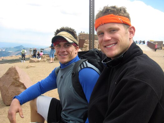 Air Force Academy Cadets 1st Class Stephen Newell and Stephen Shaffer take a break after carrying injured hiker Marian Steele to the summit of Pikes Peak July 17, 2010. Ms. Steele, a resident of Colorado Springs, Colo., had broken her foot while descending the 14,110-foot mountain. (U.S. Air Force photo courtesy of Cadet 1st Class Stephen Shaffer)
