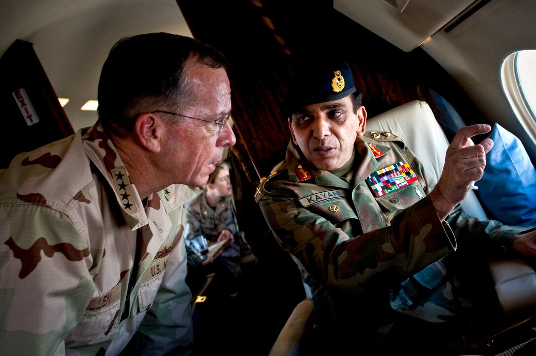 Pakistani Chief of Army Staff Gen. Ashfaq Parvez Kayani points out a feature to U.S. Navy Adm. Mike Mullen, chairman of the Joint Chiefs of Staff, during an aerial tour of northern Pakistan, July 24, 2010.