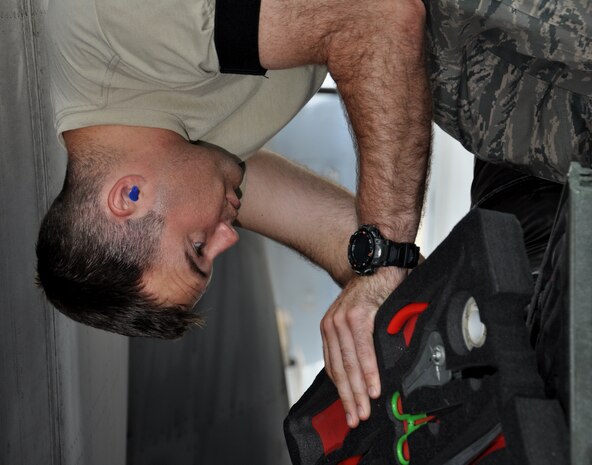 Tech. Sgt. Christopher Shea selects the proper tools needed to replace a VHF antenna connector on a C-17 Globemaster III July 23, 2010, at Charleston Air Force Base, S.C. Sergeant Shea is a communication and navigation specialist with the 315th Aircraft Maintenance Squadron here. (U.S. Air Force photo/Staff Sgt. Shane Ellis)