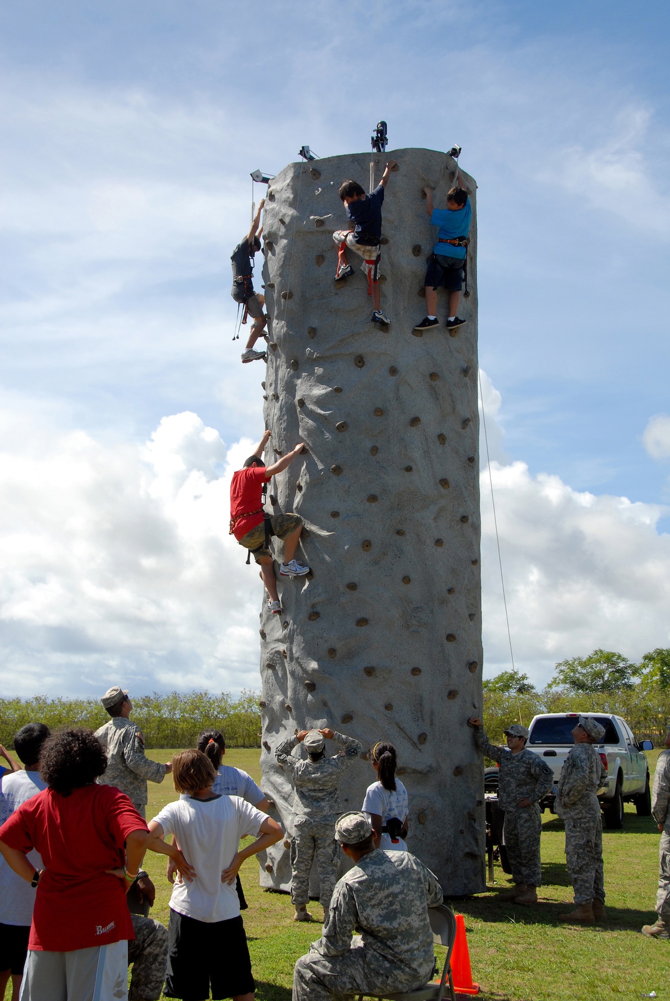 Members of the Air and Army National Guard Counterdrug program provide the rock wall climbing activity for the children during a Drug Demand Reduction presentation at the University of Guam, June 29. (U.S. Air Force photo/Tech. Sgt. Betty J. Squatrito-Martin)