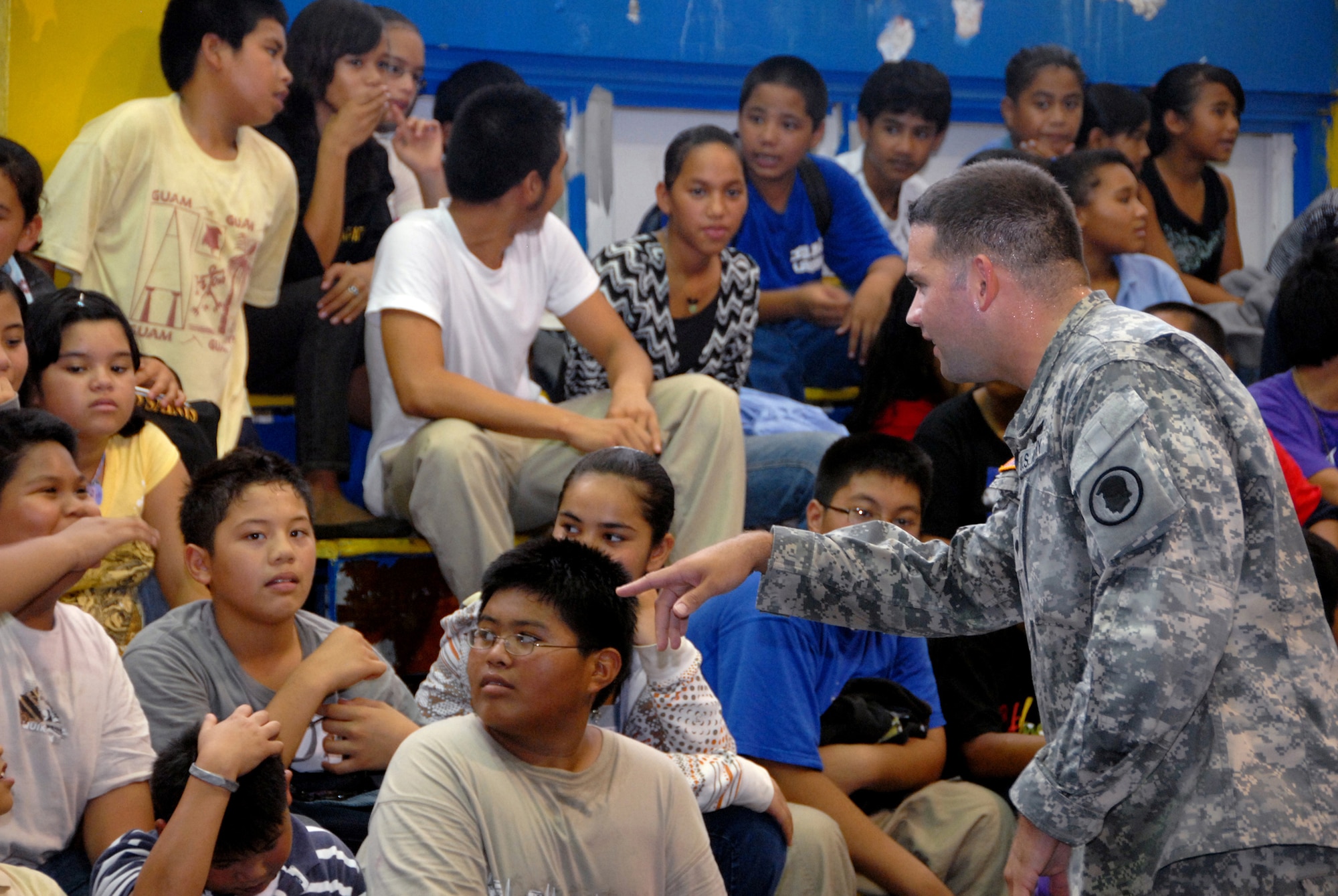 Specialist Bruce Blanton, Counterdrug Hawaii National Guard, debriefs students from V.S.A. Benavente Middle School on Guam, following team building exercises led by Counterdrug personnel June 29. The Counterdrug team visited the school as part of the counter drug program, Drug Demand Reduction program, which emphasizes education and training as part of its drug abuse prevention program. (U.S. Air Force photo/Tech. Sgt. Betty J. Squatrito-Martin) 