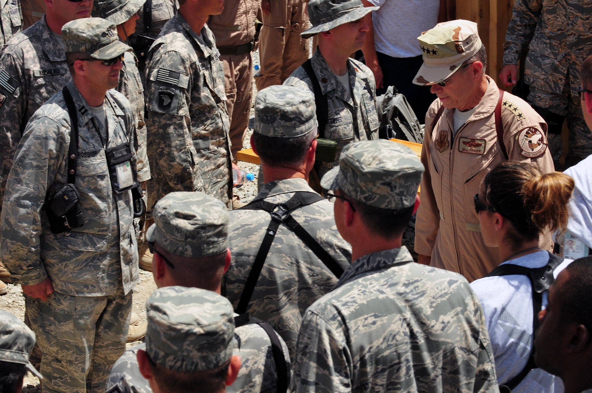 100723-N-6031Q-015 KABUL, Afghanistan - Gen. William M. Fraser III, Commander of the Air Combat Command, finishes a speech given to a crowd of Airmen during his visit to the Afghan Air Force Base in Kabul on July 23, 2010. Fraser, along with Lt. Gen. Michael Hostage, U.S. Air Forces Central commander, toured the "Thunder Lab", an English immersion program for Afghan pilot candidates. Fraser also toured the living quarters and demonstrated his own pilot skills on the Rotary Wing flight simulator. The visit gave Fraser the opportunity to meet various service members working with the Combined Air Power Transition Force as well as Gen. Darwan, Commanding General of the Afghan Air Force. (US Navy photo by Mass Communication Specialist 2nd Class David Quillen/ RELEASED).