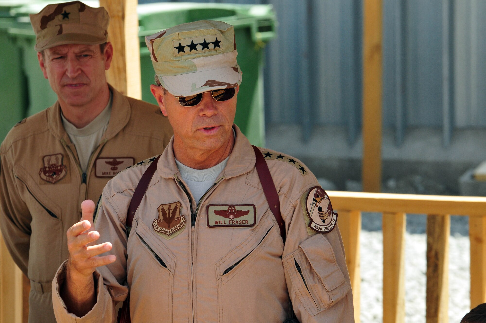 100723-N-6031Q-014 KABUL, Afghanistan - Brig. Gen. Michael Boera, Commanding General, 438th Air Expeditionary Wing, listens to Gen. William M. Fraser III, Commander of the Air Combat Command, as he talks to a crowd of Airmen during his visit to the Afghan Air Force Base in Kabul on July 23, 2010. Fraser, along with Lt. Gen. Michael Hostage, U.S. Air Forces Central commander, toured the "Thunder Lab", an English immersion program for Afghan pilot candidates. Fraser also toured the living quarters and demonstrated his own pilot skills on the Rotary Wing flight simulator. The visit gave Fraser the opportunity to meet various service members working with the Combined Air Power Transition Force as well as Gen. Darwan, Commanding General of the Afghan Air Force. (US Navy photo by Mass Communication Specialist 2nd Class David Quillen/ RELEASED).