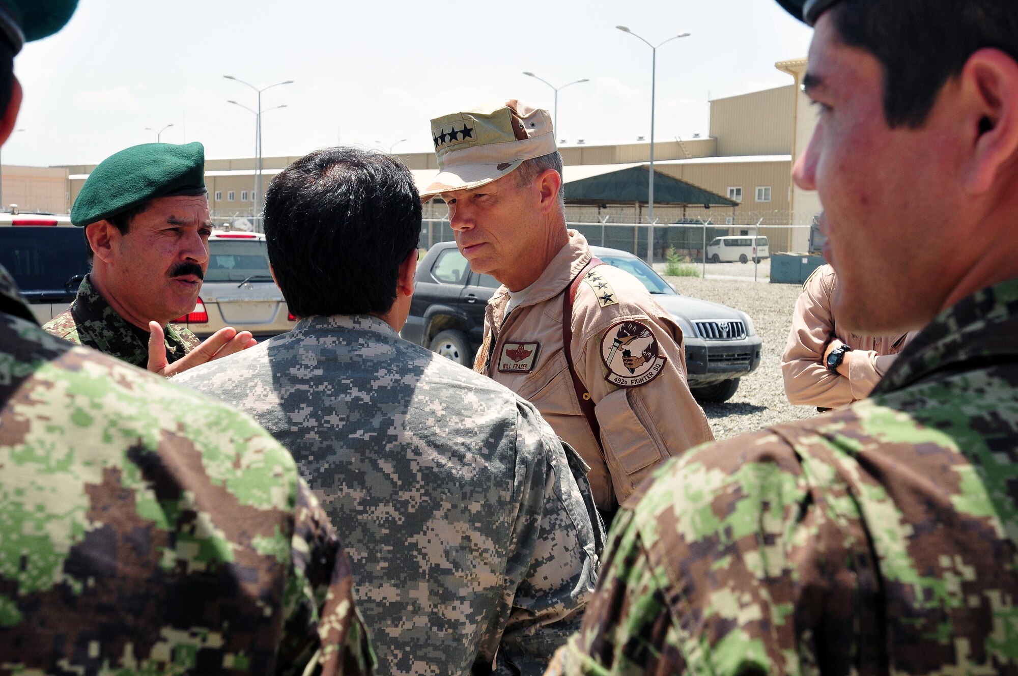 100723-N-6031Q-012 KABUL, Afghanistan - Gen. William M. Fraser III, Commander of the Air Combat Command, talks with Gen. Darwan, Commanding General of the Afghan Air Force during his visit to the Afghan Air Force Base in Kabul on July 23, 2010. Fraser, along with Lt. Gen. Michael Hostage, U.S. Air Forces Central commander, toured the "Thunder Lab", an English immersion program for Afghan pilot candidates. Fraser also toured the living quarters and demonstrated his own pilot skills on the Rotary Wing flight simulator. The visit gave Fraser the opportunity to meet various service members working with the Combined Air Power Transition Force. (US Navy photo by Mass Communication Specialist 2nd Class David Quillen/ RELEASED).