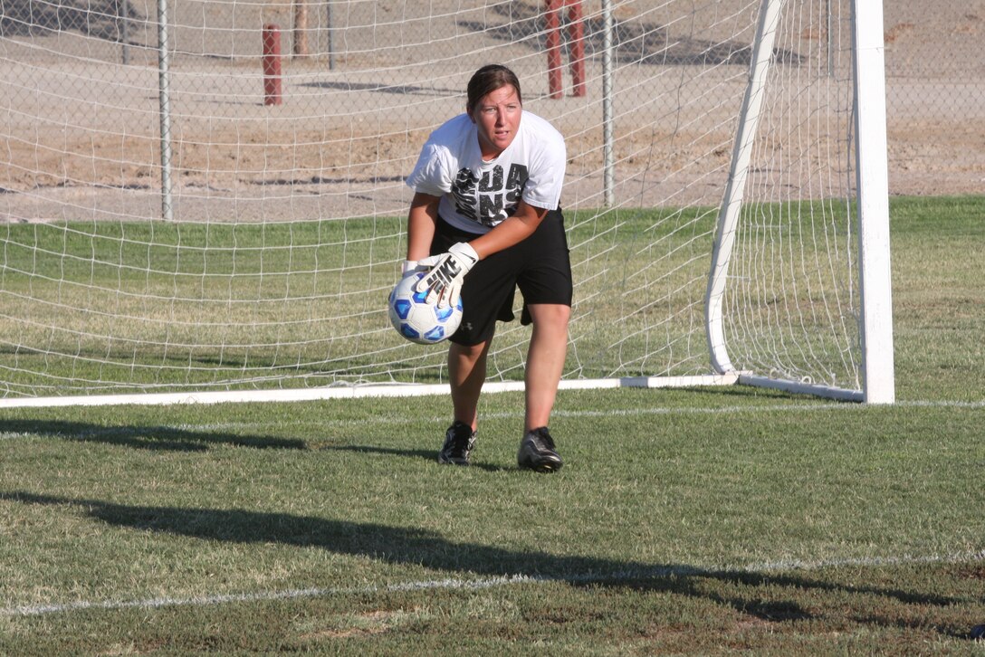 Rebecca Mccants, the goalkeeper on the women’s varsity soccer team, prepares to throw the ball to a teammate during a practice July 26 at Felix Field. For the first time in the history of the Combat Center, a women’s varsity soccer team has been formed.