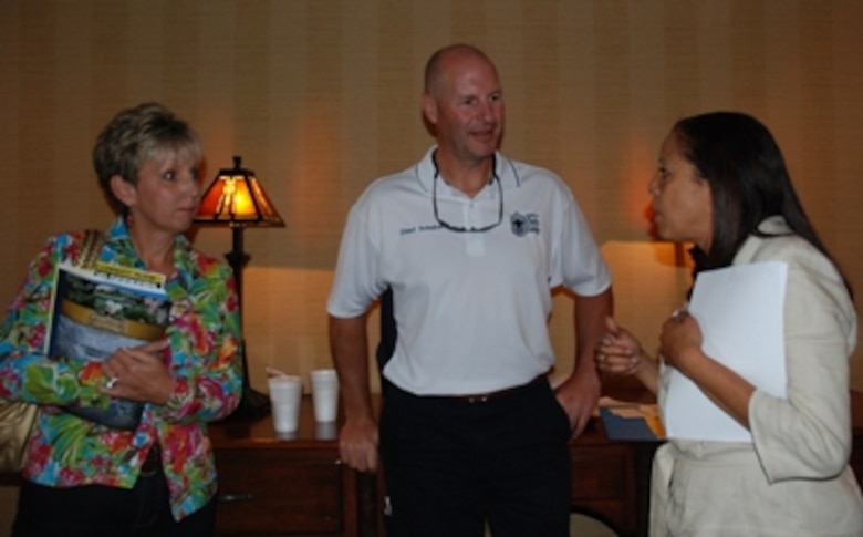 Tech. Sgt. Cynthia Owens, Dobbins’ Yellow Ribbon program manager (right) talks with attendees in Gatlinburg, Tenn., at a Yellow Ribbon Reintegration Program, July 23-25.  (U.S. Air Force photo/J.D. Marckmann)