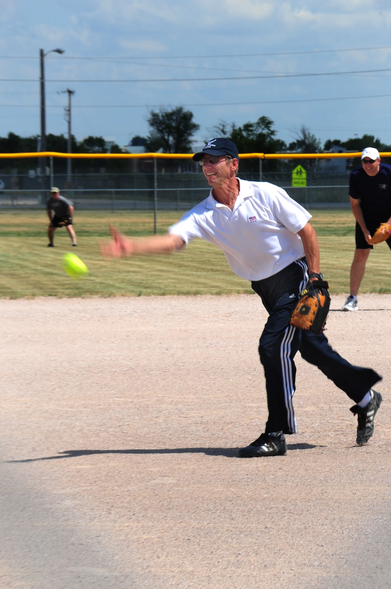 ELLSWORTH AIR FORCE BASE, S.D. – Chief Master Sgt. (Ret.) Carl Engwall, 28th Bomb Wing Air and Space Museum director, pitches a softball during the annual Chiefs vs. Eagles game, July 23.  The softball game was part of the annual base picnic. (U.S. Air Force photo/Airman 1st Class Anthony Sanchelli)