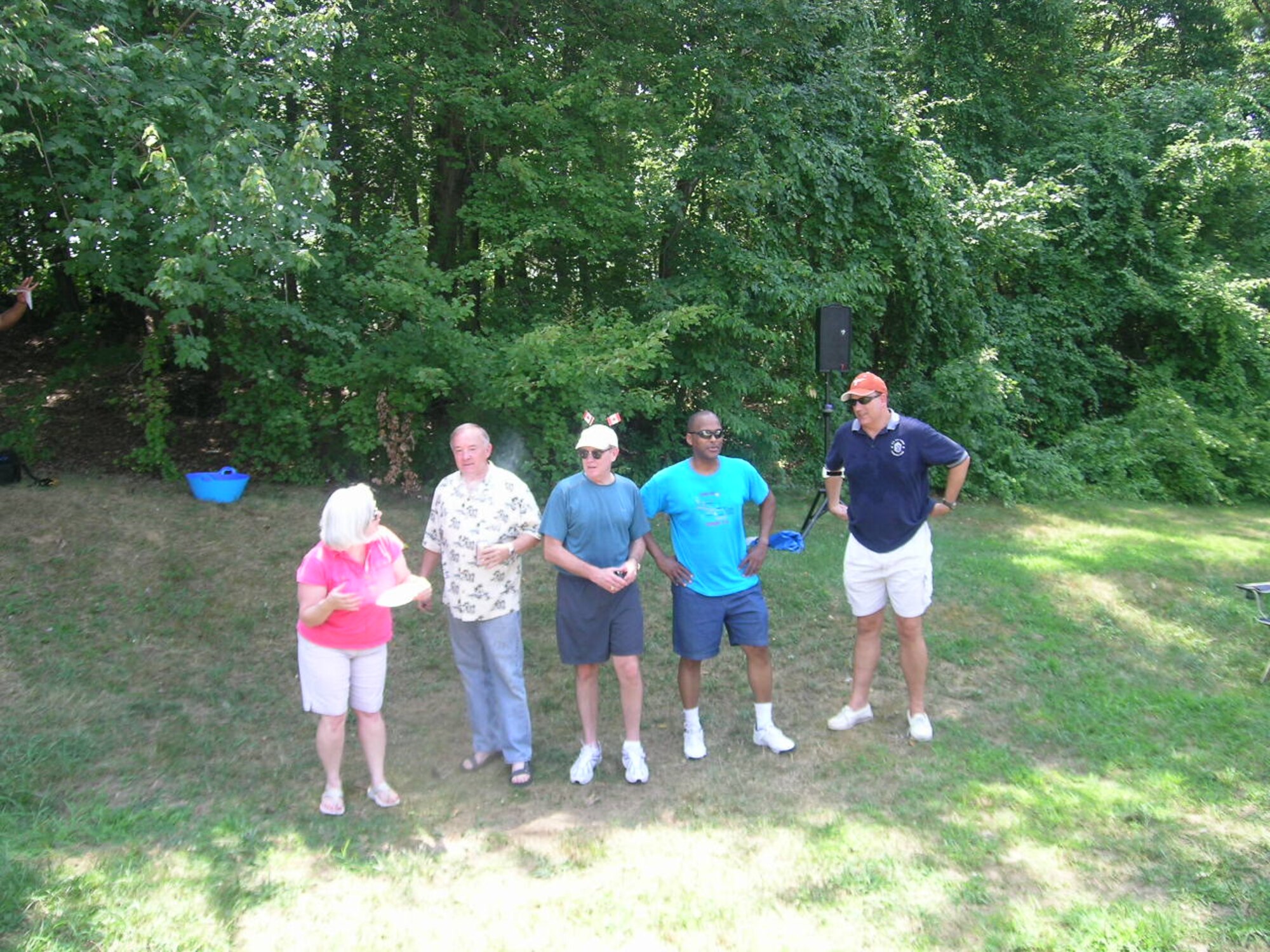 Members of the AFDW staff await their turn in the "dunking booth" during the 2010 AFDW Family Day Picnic held July 23, 2010, at Freedom Park, Andrews AFB, Md. The top five vote receipents for the dunking booth are from left to right are: Kathleen Kearney, ”TK” Kearney director of staff, Ryan Ferrell Manpower, Personnel and Services director, Lt. Col. Henry Lane Anaylses, Assesments and Lessons Learned deputy director, and Command Chief Master Sgt. Pat Battenberg.  (U.S. Air Force photo by Aletha Frost, AFDW/PA)