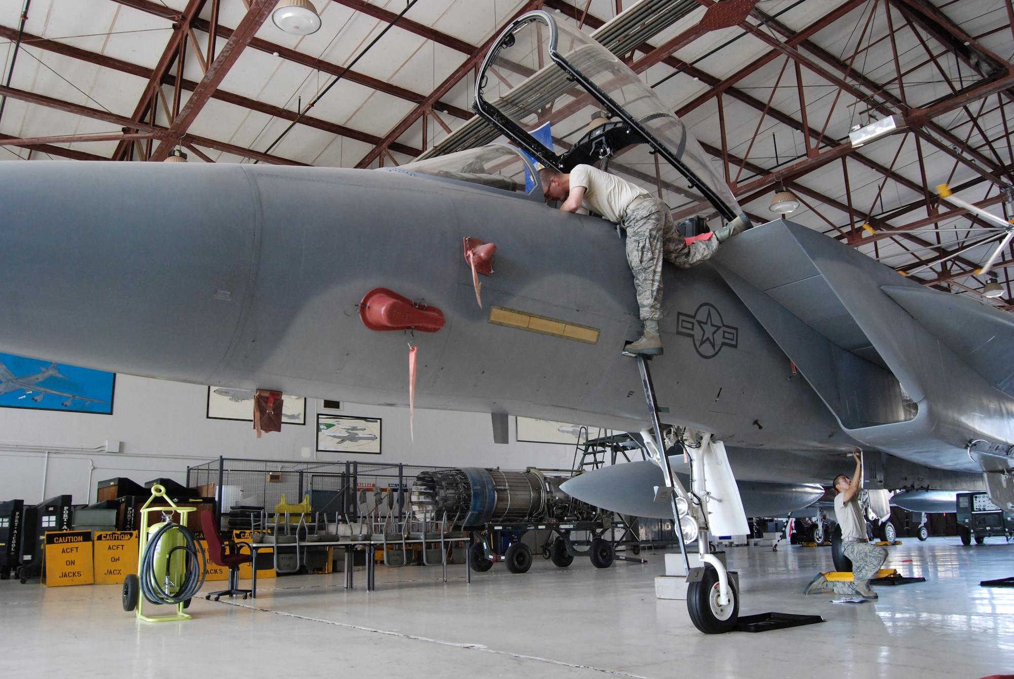Students in the F-15 Eagle aircraft maintenance course perform a Safe for Maintenance procedure on an F-15B July 23, 2010, at Sheppard Air Force Base, Texas. Students received hands-on F-15 maintenance training on F-15A and F-15B models and were briefed on the differences between their aircraft and the ones on operational flightlines, the F-15C and F-15D. (U.S. Air Force photo/Tech. Sgt. Vernon Cunningham)