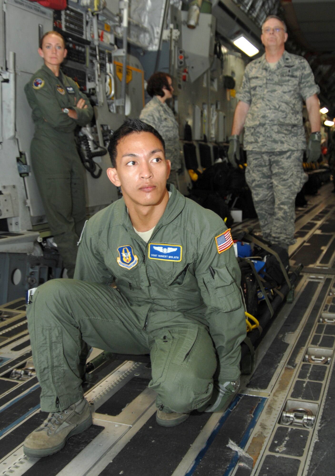 BUSH FIELD, Augusta, Ga. - Staff Sgt. Robert Molato, an aeromedical evacuation reservist with the 446th Aeromedical Evacuation Squadron, McChord Field, Wash., gets ready to carry medical equipment off a C-17 Globemaster III aircraft, during Global Medic 2010 exercise, July 11.
The annual exercise involves Reserve units from the U.S. Army Reserve and U.S. Air Force. (U.S. Air Force photo/Senior Master Sgt. Dennis Martin)
