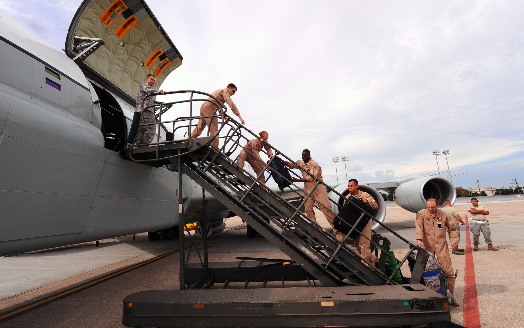 OFFUTT AIR FORCE BASE, Neb. - Airmen assigned to the 45th Reconnaissance Squadron, prepare to leave on an RC-135 aircraft for a deployment. The 45th RS supports four mission platforms which involve strategic electronic reconnaissance, ballistic missile detection, nuclear debris detection and treaty verification. Squadron members must be ready to deploy at a moment's notice. U.S. Air Force photo by Josh Plueger
