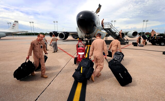OFFUTT AIR FORCE BASE, Neb. - Airmen assigned to the 45th Reconnaissance Squadron, prepare to leave on an RC-135 aircraft for a deployment. The 45th RS supports four mission platforms which involve strategic electronic reconnaissance, ballistic missile detection, nuclear debris detection and treaty verification. Squadron members must be ready to deploy at a moment's notice. U.S. Air Force photo by Josh Plueger