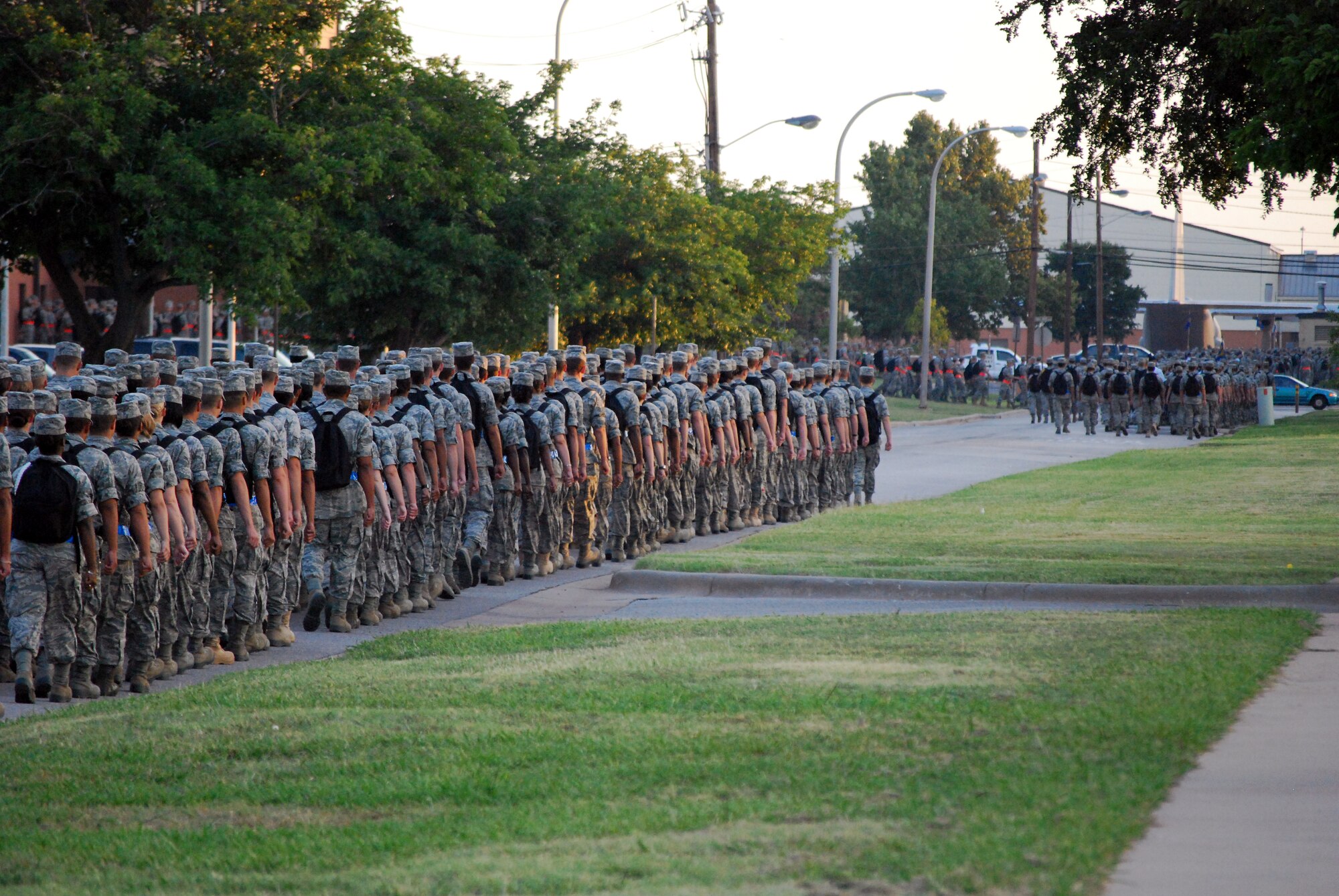 A formation from the 882nd Training Group (front) marches to their assigned training building on Sheppard Air Force Base, Texas, July 23 to begin the academic day.  The training squadrons within the 882nd TRG conduct apprentice and advanced medical training in multiple disciplines to include biomedical sciences, dental, health service administration, clinical sciences and nursing.  (U.S. Air Force photo/Tech. Sgt. Vernon Cunningham)