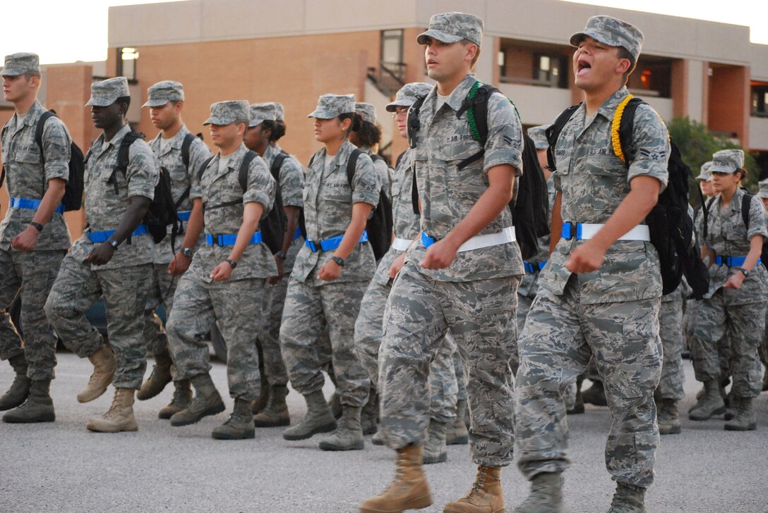 Airman leaders from the 882nd Training Group call cadence as they lead their section of the 730 Airmen in Training during their daily formation march towards their training building July 23 at Sheppard Air Force Base, Texas.  A cadence is a call and response work song that is traditionally used to keep a formation in rhythm while marching.   (U.S. Air Force photo/Tech. Sgt. Vernon Cunningham)