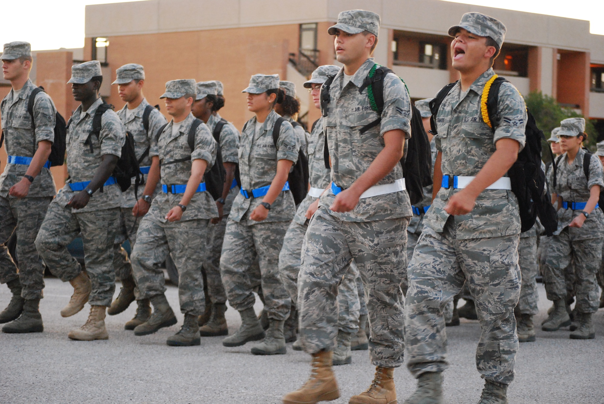 Airman leaders from the 882nd Training Group call cadence as they lead their section of the 730 Airmen in Training during their daily formation march towards their training building July 23 at Sheppard Air Force Base, Texas.  A cadence is a call and response work song that is traditionally used to keep a formation in rhythm while marching.   (U.S. Air Force photo/Tech. Sgt. Vernon Cunningham)