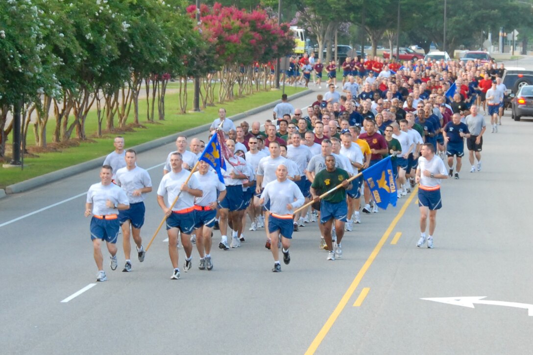 Members of the largest class to graduate from the Senior NCO Academy at Maxwell Air Force Base, Ala., joined First Sergeant Academy members to celebrate with a combined formation run July 20, 2010, at nearby Gunter Annex The SNCOA graduation took place July 21. (U.S. Air Force photo/Jamie Pitcher)