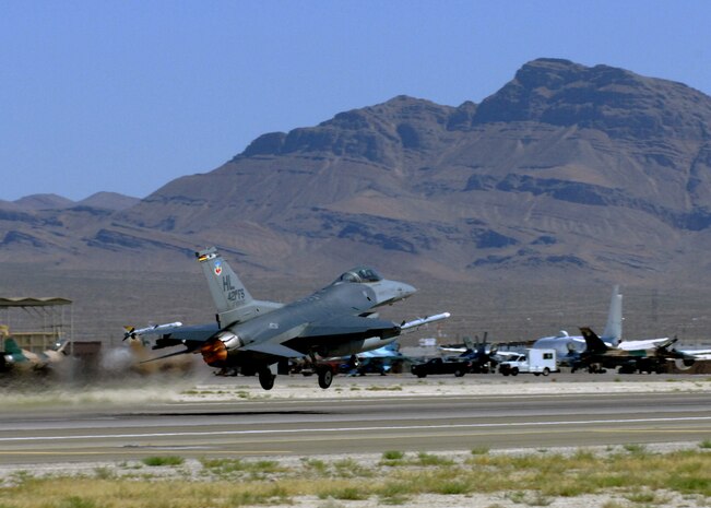 NELLIS AIR fORCE BASE, Nev. -- An F-16 from the 4th Fighter Squadron, Hill Air Force Base, Utah takes off the runway for Green Flag here July 21, 2010.The 4th FS trained with the U.S. Army in realistic air-land integration scenarios at the National Training Center, Fort Irwin, Calif., July 11-23 in preparation for upcoming deployment to Afghanistan in in support of counter-insurgency operations. (U.S. Air Force photo by Airman 1st Class Daniel Phelps)