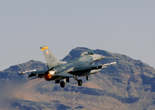 NELLIS AIR fORCE BASE, Nev. -- An F-16 from the 4th Fighter Squadron, Hill Air Force Base, Utah takes off the runway for Green Flag here July 21, 2010.The 4th FS trained with the U.S. Army in realistic air-land integration scenarios at the National Training Center, Fort Irwin, Calif., July 11-23 in preparation for upcoming deployment to Afghanistan in in support of counter-insurgency operations. (U.S. Air Force photo by Airman 1st Class Daniel Phelps)