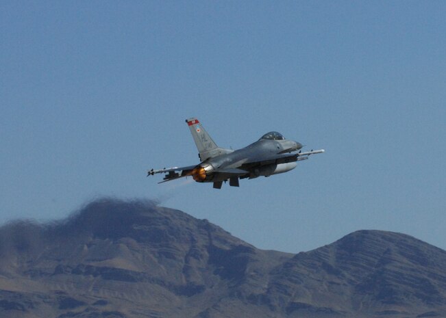 NELLIS AIR fORCE BASE, Nev. -- An F-16 from the 4th Fighter Squadron, Hill Air Force Base, Utah takes off the runway for Green Flag here July 21, 2010.The 4th FS trained with the U.S. Army in realistic air-land integration scenarios at the National Training Center, Fort Irwin, Calif., July 11-23 in preparation for upcoming deployment to Afghanistan in in support of counter-insurgency operations. (U.S. Air Force photo by Airman 1st Class Daniel Phelps)