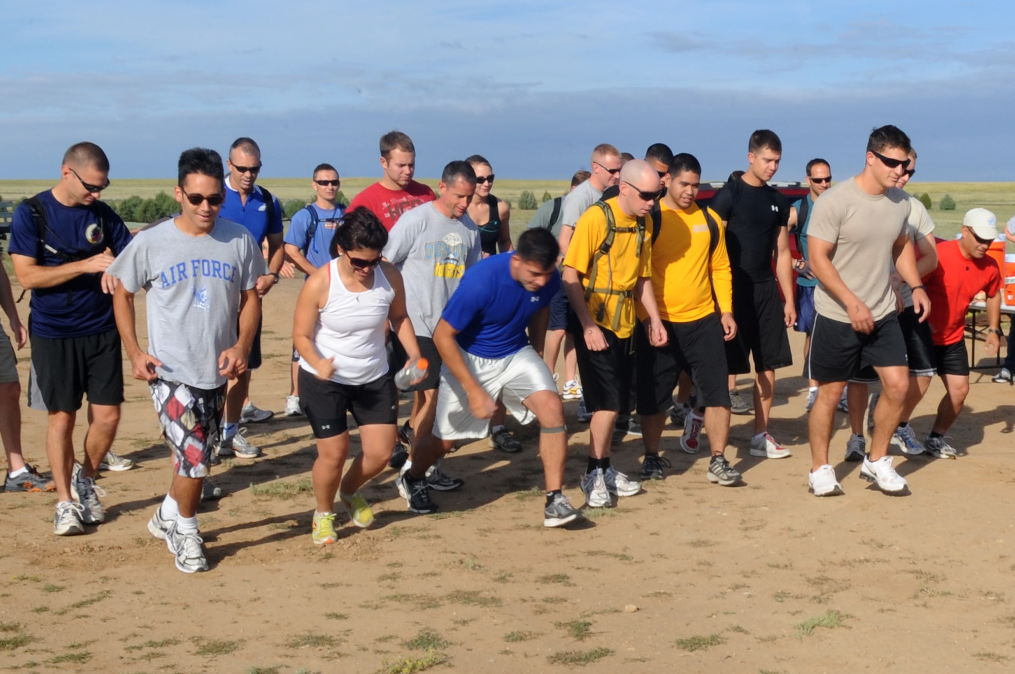 BUCKLEY AIR FORCE BASE, Colo.-- Members of Team Buckley compete against each other in teams of two during the Adventureman Race July 24. The race consisted of different obstacles and challenges while completing a 15-mile run. (U.S. Air Force Photo by Airman 1st Class Manisha Vasquez)