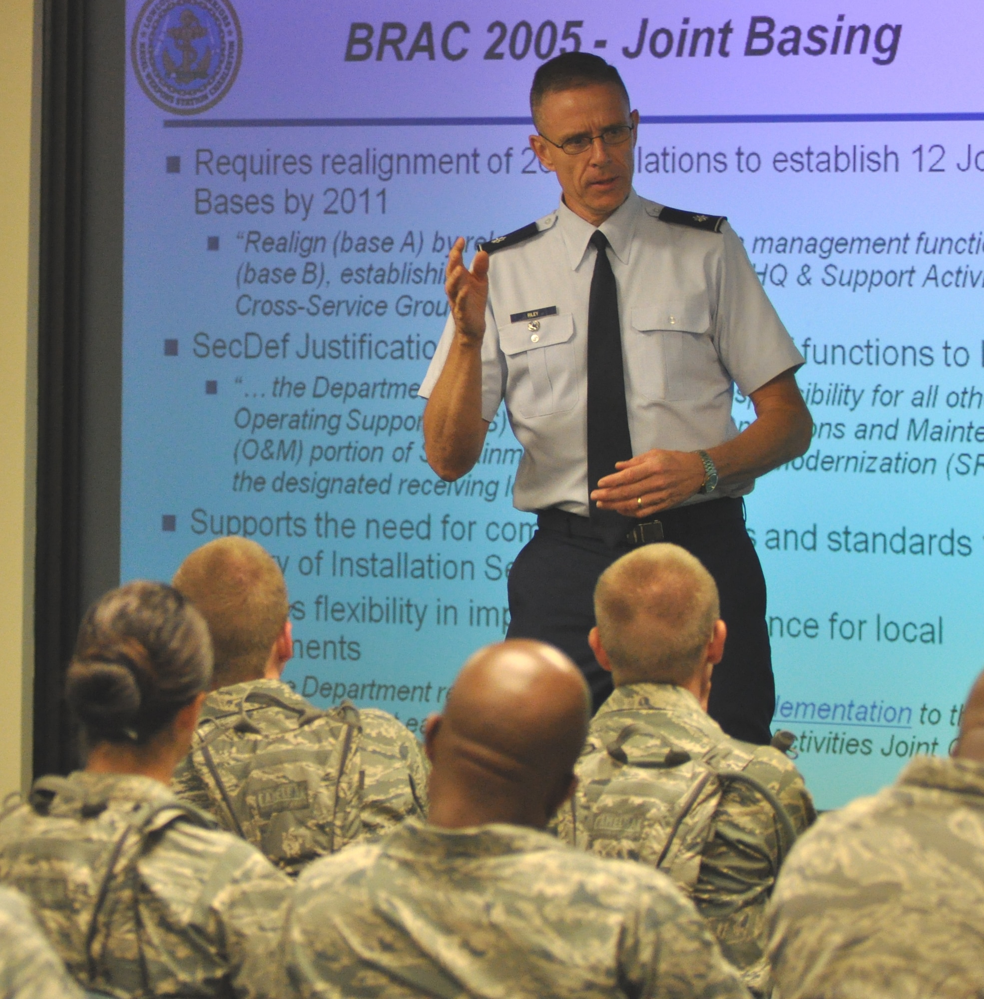 Lt. Col. Kevin Riley discusses operational structure and function of 628th Joint Base Charleston July 26, 2010, at Charleston Air Force Base, S.C., to 30 Air Force chaplain candidates. Lt. Col. Riley is the 628th Joint Base Charleston joint basing coordinator. (U.S. Air Force photo/Staff Sgt. Shane Ellis)