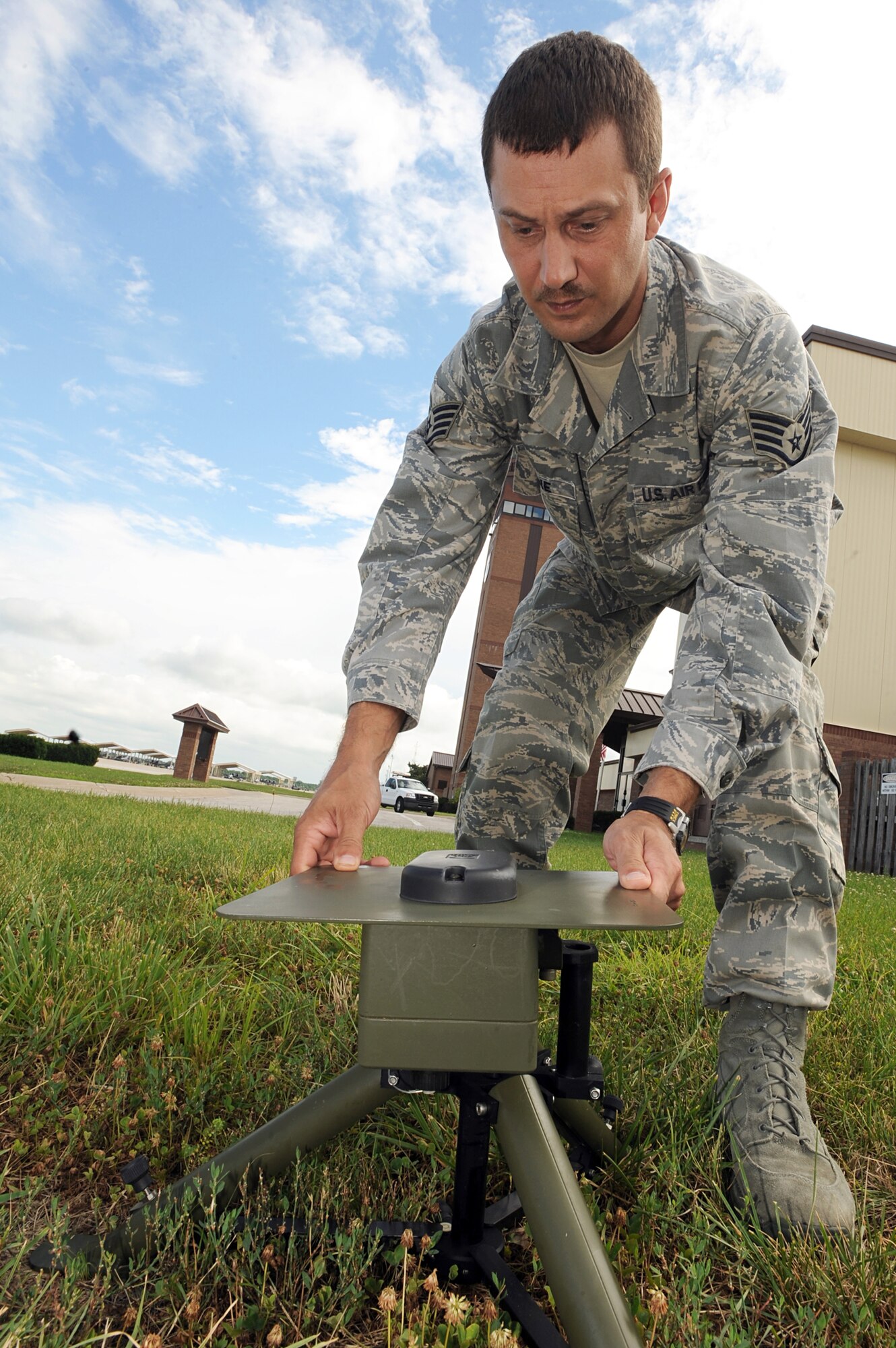Staff Sgt. Charles Malone readies a surveying instrument as part of the Tactical Meteorological Observing System station, July 6, 2010, at Whiteman Air Force Base, Mo. The TMOS systems can be set up and sending data within 15 minutes. Sergeant Malone is a 509th Operation Support Squadron weather forecaster. (U.S. Air Force photo/Senior Airman Carlin Leslie)