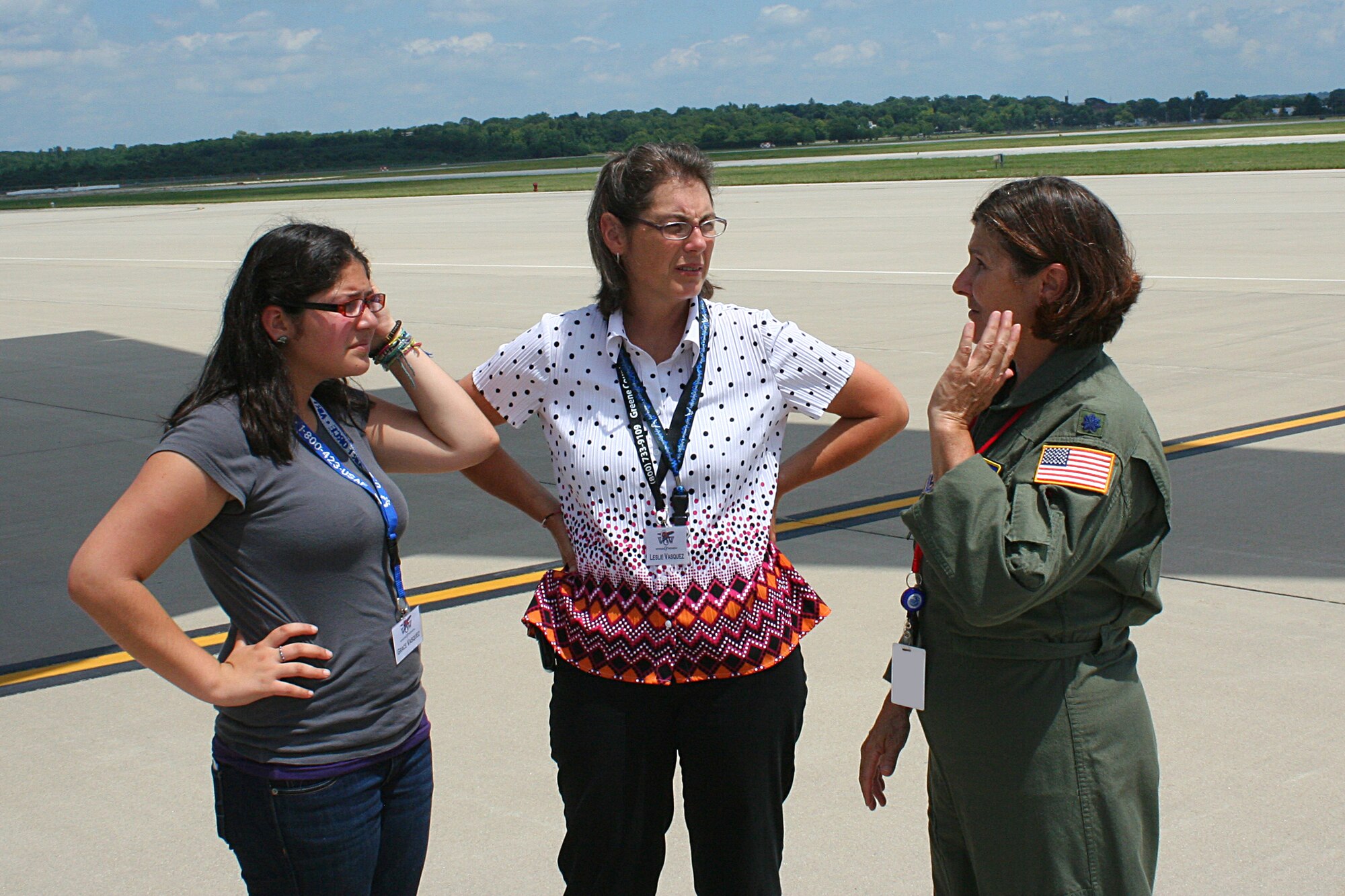WRIGHT-PATTERSON AIR FORCE BASE, Ohio – Lt. Col. Linda Stokes-Crowe, 445th Aeromedical Evacuation Squadron, talks with Leslie Vasquez and her daughter, Grace, during the National Aviation Hall of Fame's Fourth Annual Wings of Women conference July 16.  Attendees were able to spend the afternoon at the 445th Airlift Wing not only touring a C-5 but also participating in demonstrations by the 445th Aircrew Flight Equipment shop and the 445th AES. (U.S. Air Force photo/Senior Airman Mikhail Berlin)