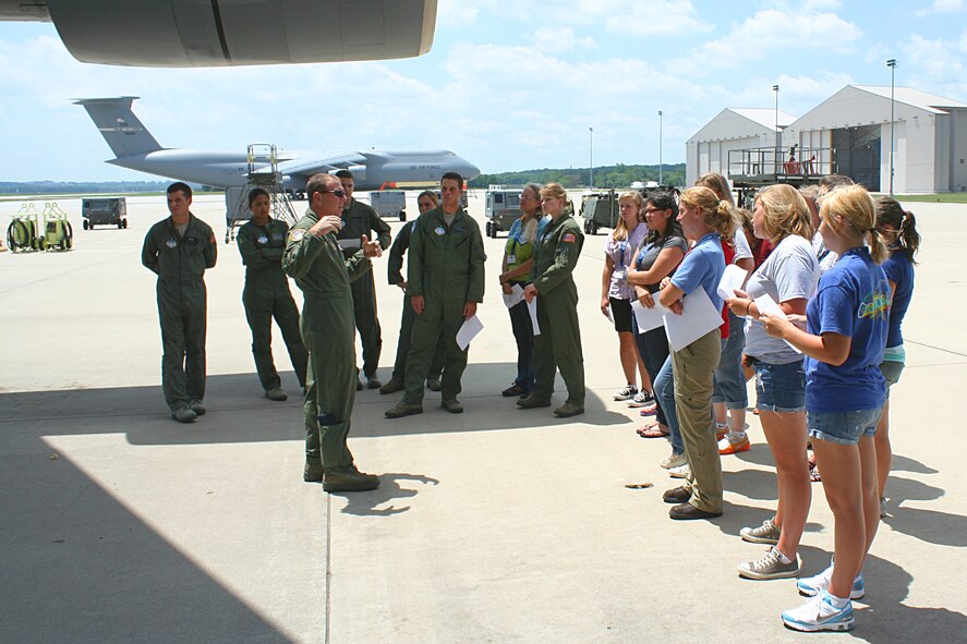 WRIGHT-PATTERSON AIR FORCE BASE, Ohio – Master Sgt. Jeremy Turner, 89th Airlift Squadron, explains the mechanics of a C-5 Galaxy to a group of young ladies attending the National Aviation Hall of Fame's Fourth Annual Wings of Women conference July 16. Attendees spent the afternoon at the 445th Airlift Wing not only touring a C-5 but also participating in demonstrations by the 445th Aircrew Flight Equipment shop and the 445th Aeromedical Evacuation Squadron. (U.S. Air Force photo/Senior Airman Mikhail Berlin)