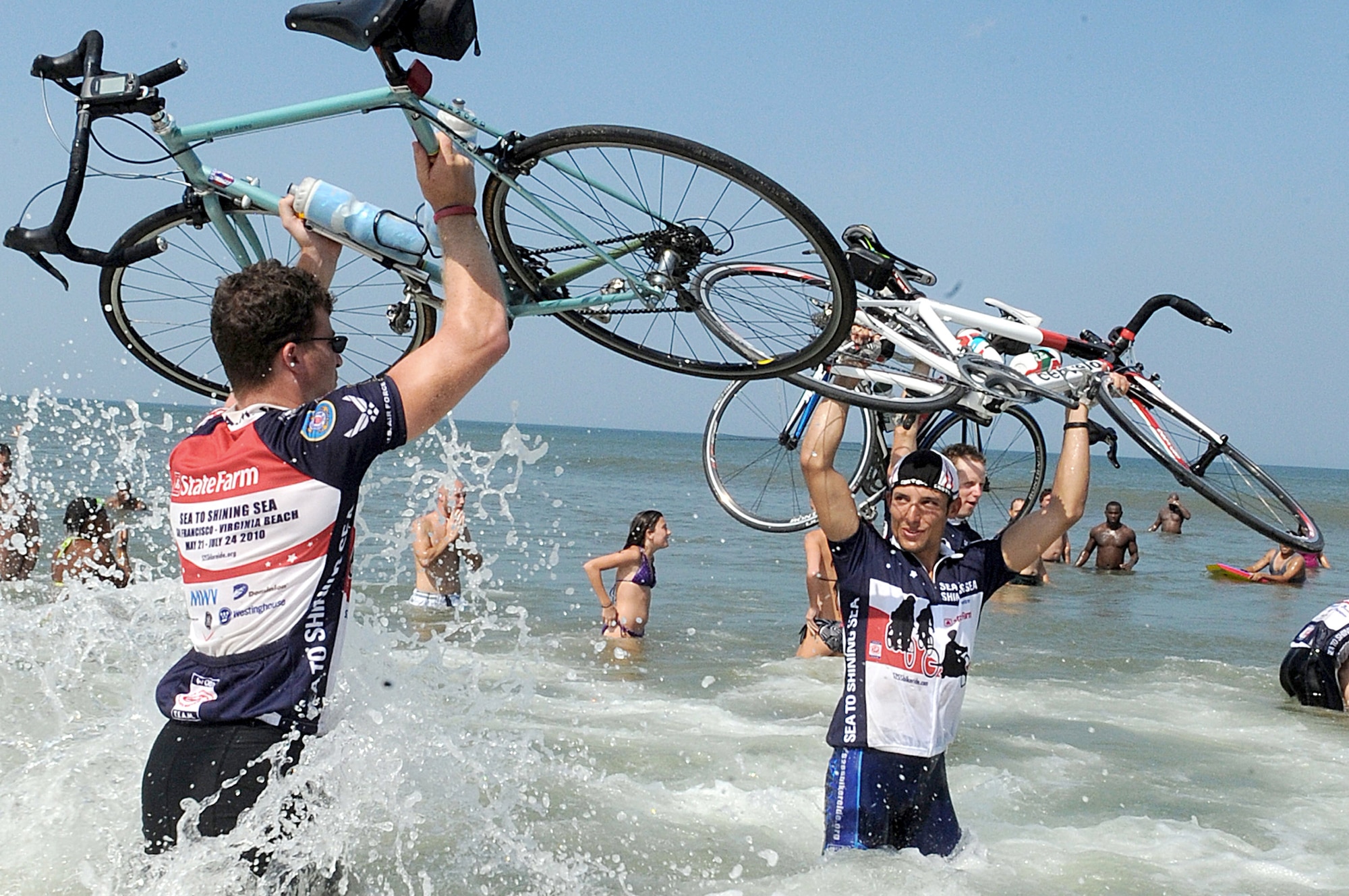 Riders celebrate in the Atlantic Ocean during the closing ceremony of Sea to Shining Sea July 24, 2010, in Virginia Beach, Va. Sea to Shining Sea is a 4,000-mile bike ride that started at the Golden Gate Bridge in San Francisco, and ended in Virginia Beach. (U.S. Air Force photo/Staff Sgt. Christina M. Styer)
