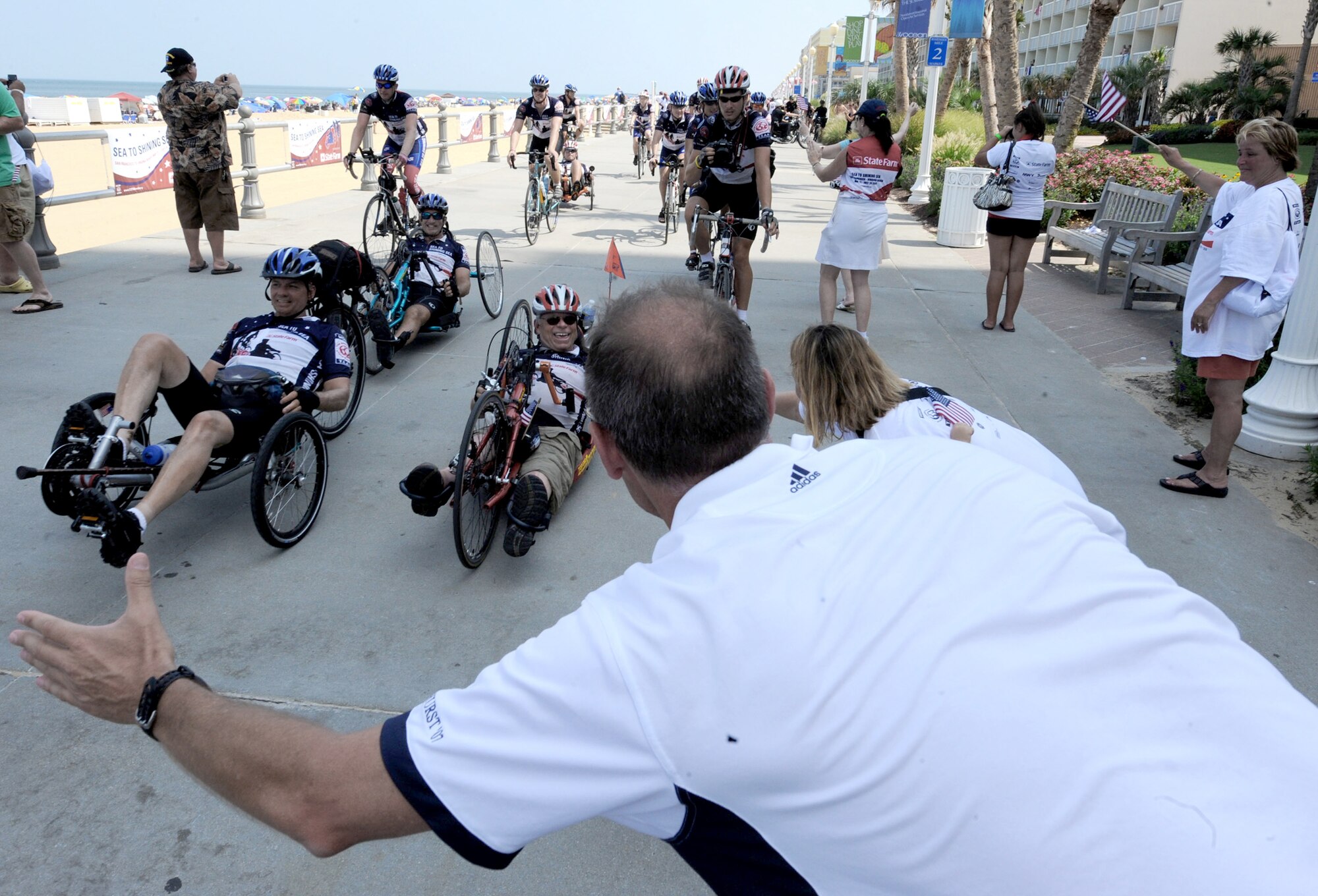 Sea to Shining Sea riders arrive July 24, 2010, in Virginia Beach, Va., to a crowd of family members and local supporters. Sea to Shining Sea is a 4,000-mile bike ride that started at the Golden Gate Bridge in San Francisco, and ended in Virginia Beach. (U.S. Air Force photo/Staff Sgt. Christina M. Styer)