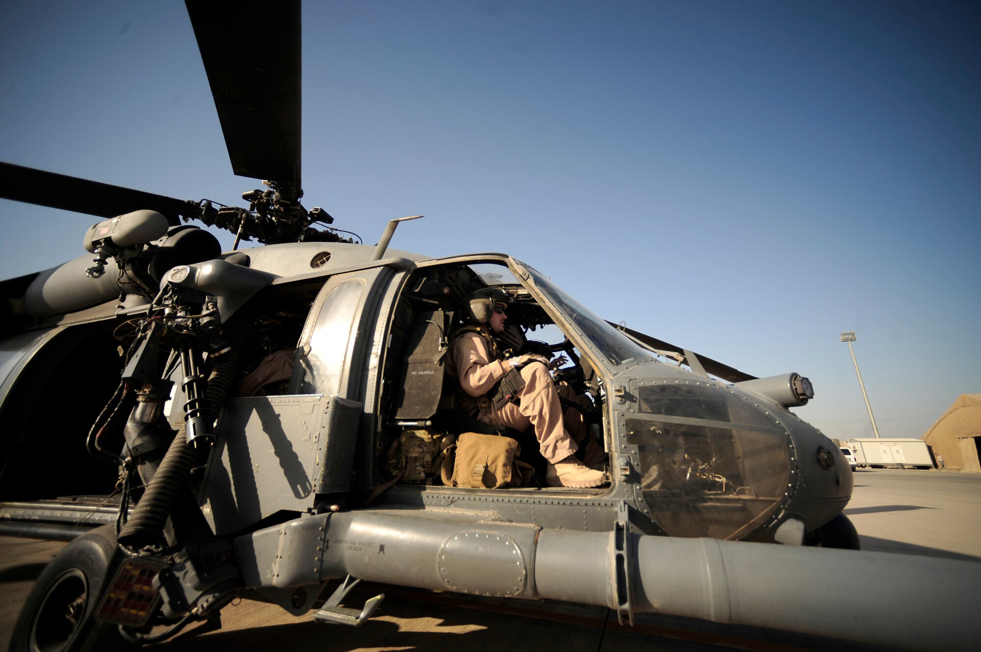 Capt. Jay Humphrey runs through pre-flight checklist with crew before a mission July 12, 2010, at Joint Base Balad, Iraq. Captain Humphrey is an HH-60G Pave Hawk pilot assigned to the 64th Expeditionary Rescue Squadron.   (U.S. Air Force photo/Staff Sgt. Andy M. Kin)