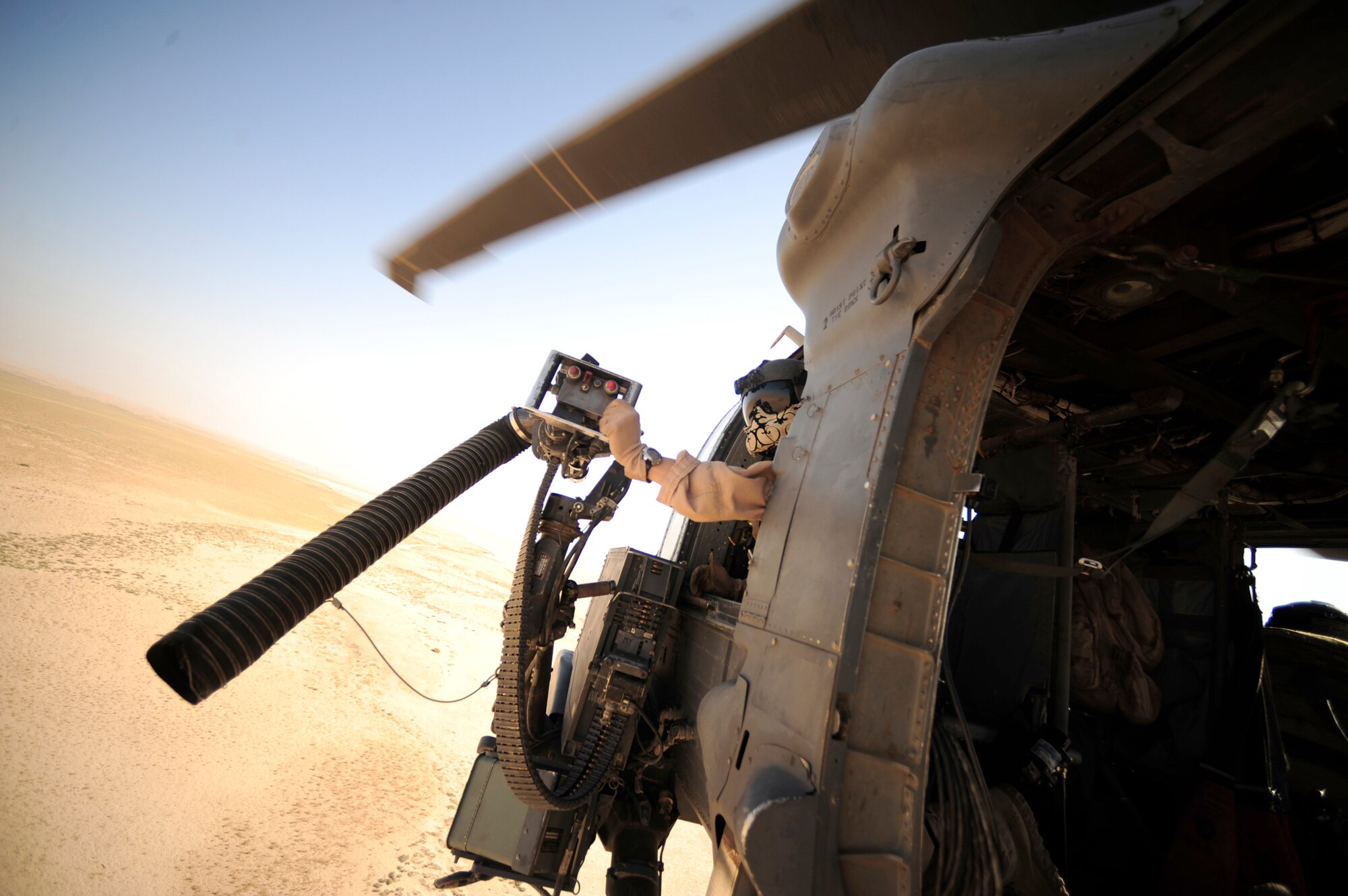 Staff Sgt. Andrew Pena scans his sector as a gunner during a mission July 12, 2010, at Joint Base Balad, Iraq. Sergeant Pena is an HH-60G Pave Hawk aerial gunner assigned to the 64th Expeditionary Rescue Squadron.  (U.S. Air Force photo/Staff Sgt. Andy M. Kin)