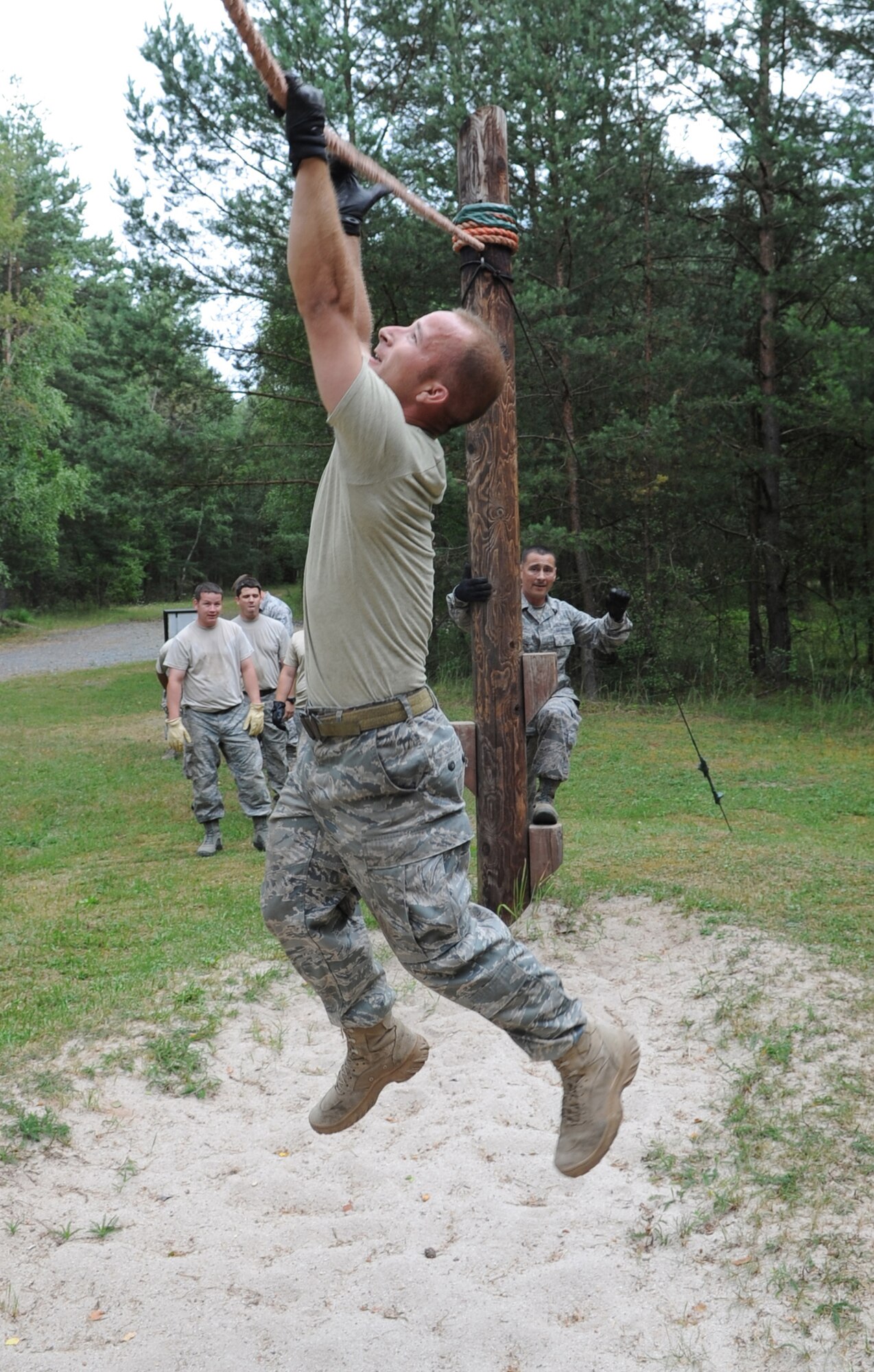 Staff Sgt. Till Schanz attempts to complete an obstacle during Exercise Allied Strike 10 July 23, 2010, in Grafenwoehr, Germany. Sergeant Schanz is assigned to the 4th Air Support Operations Squadron power productions flight.  (U.S. Air Force photo/Senior Airman Caleb Pierce) 