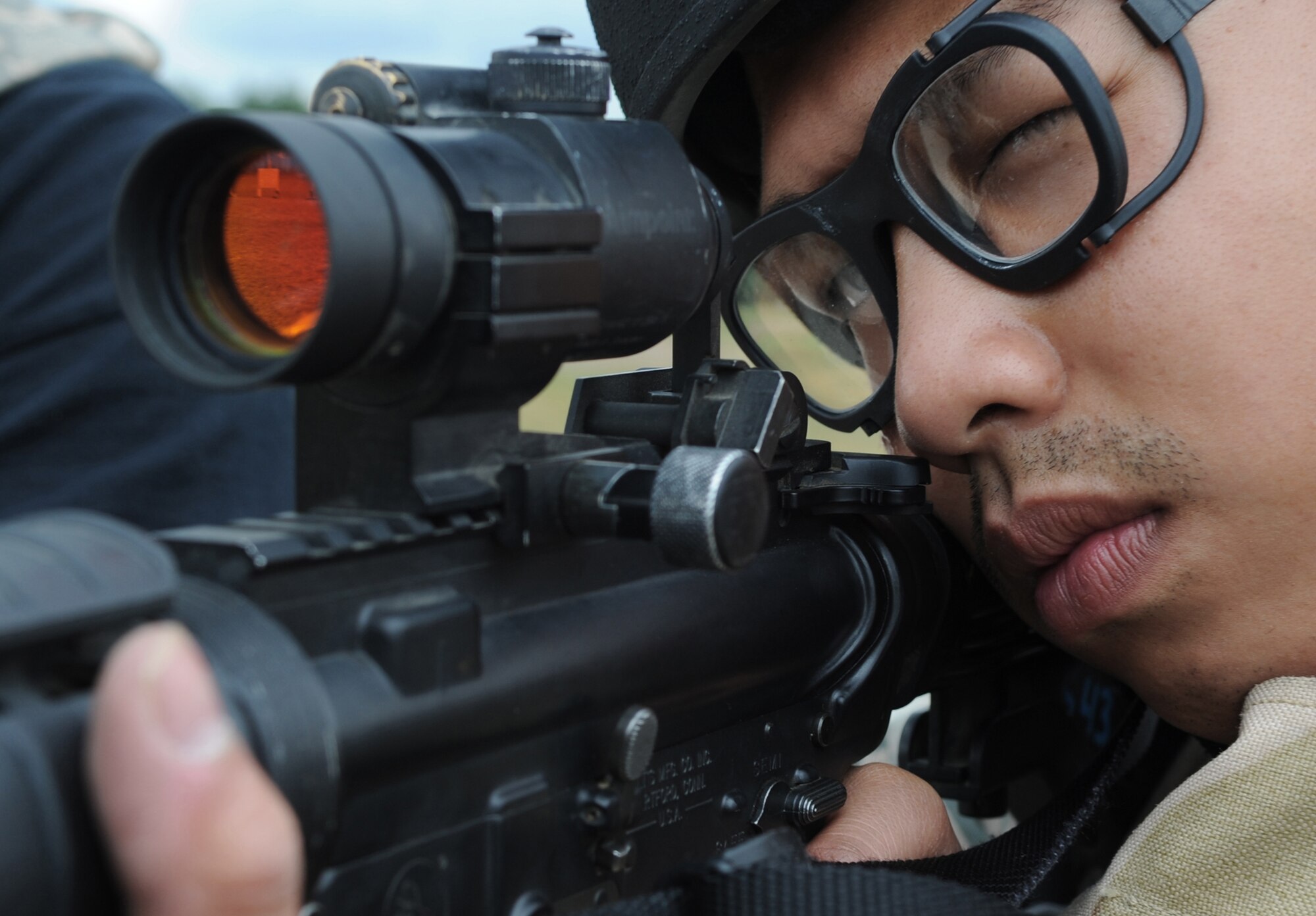Capt. Jose Cadelina zeros in his M-4 rifle during Exercise Allied Strike 10 July 23, 2010, in Grafenwoehr, Germany. Captain Cadelina is the 4th Air Support Operations Squadron fighter duty officer. (U.S. Air Force photo/Senior Airman Caleb Pierce) 