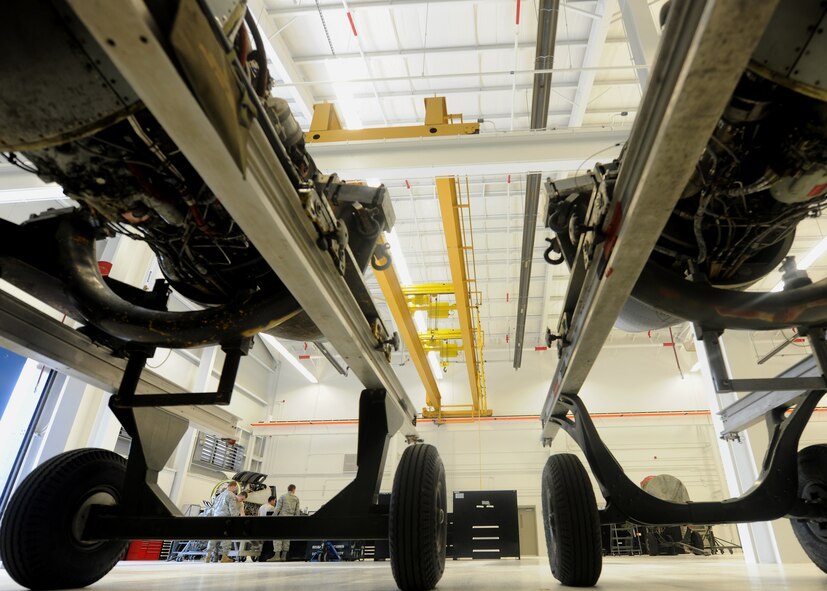 MOODY AIR FORCE BASE, Ga. -- Two TF-34 engines from an A-10C Thunderbolt II wait to be repaired as members from the 23rd Component Maintenance Squadron work on an engine from an HC-130P/N Combat King here July 22. Since the opening of a new repair facility, engines from the A-10C, HC-130P/N and HH-60G Pave Hawk aircraft are maintained together in one building. (U.S. Air Force photo by Airman 1st Class Benjamin Wiseman/RELEASED)