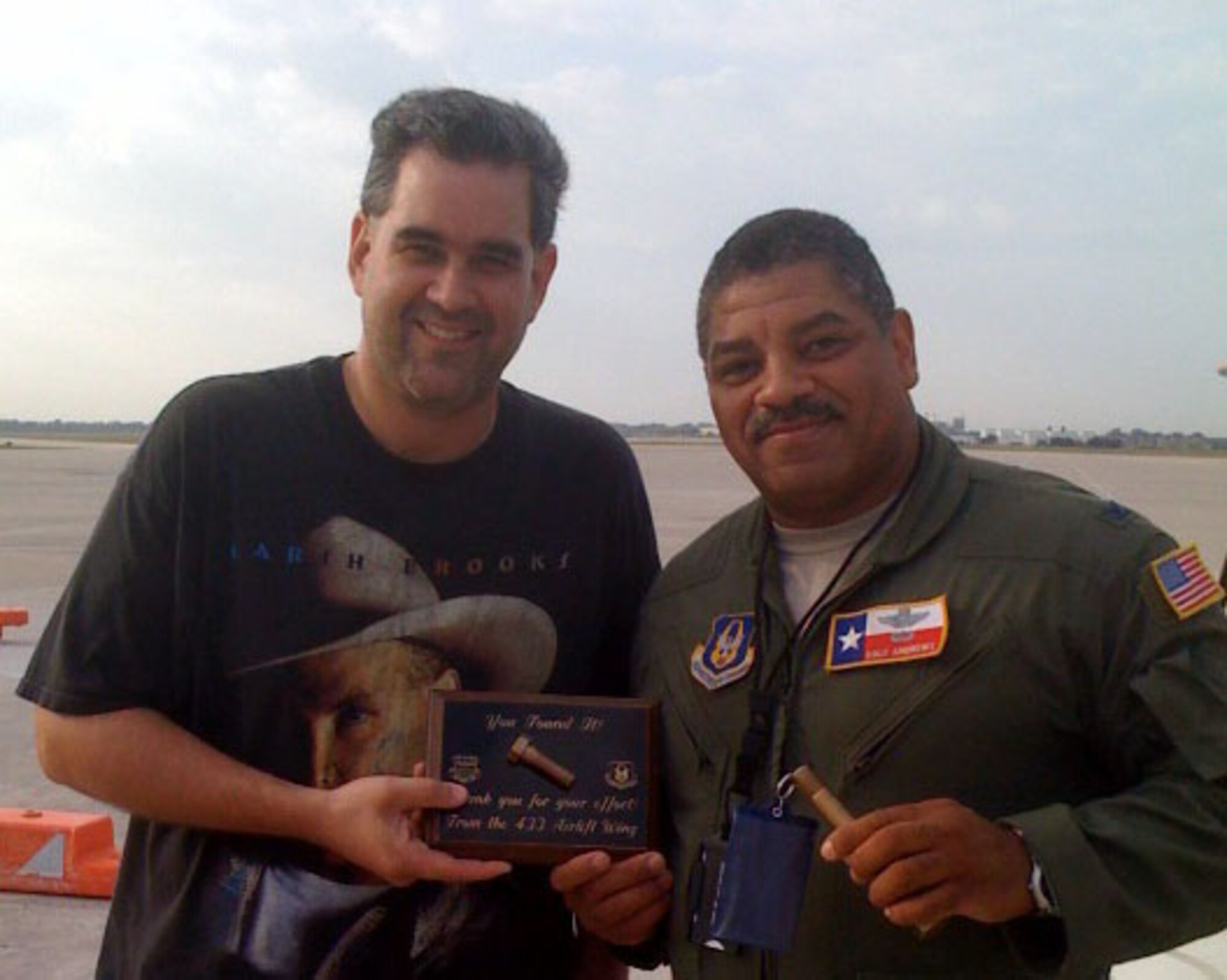 Staff Sgt. William Matthews, a member of the 433rd Aircraft Maintenance Squadron, found this golden bolt during a foreign object damage walk and was awarded for his efforts with a plaque presented by Col. Dale Andrews, 433rd Airlift Wing vice commander. FOD walks are held every Monday morning on the Lackland AFB flightline. Members of the Air Force Reserve's 433rd Airlift Wing and the 149th Fighter Wing of the Texas Air National Guard take part in the walks to ensure there are no objects on the flightline that could be sucked into a jet engine to damage it. (U.S. Air Force photo by Tech. Sgt. Carlos A. Trevino)