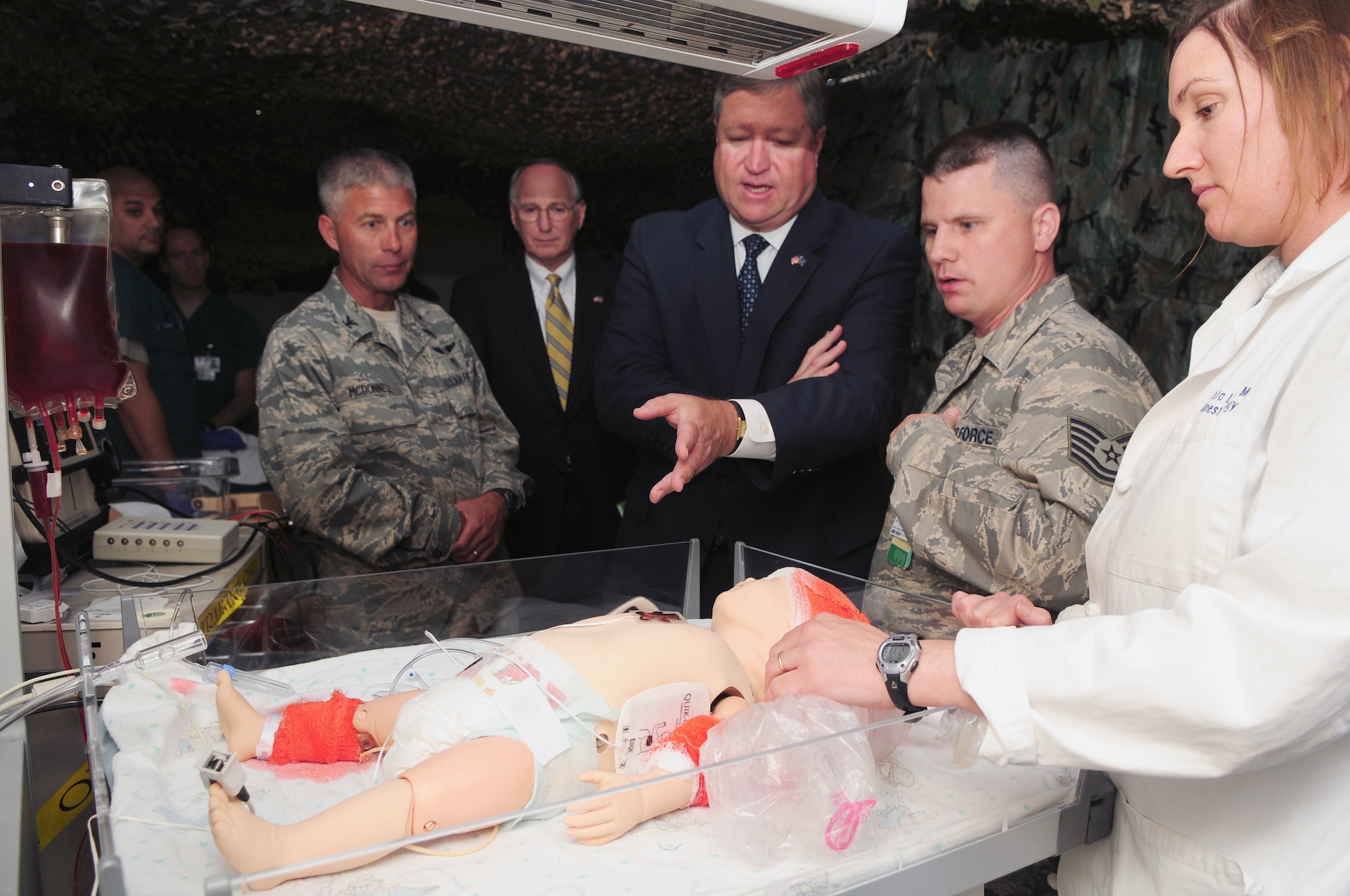 Secretary of the Air Force Michael Donley (center) observes a medical training demonstration July 22, 2010, by Airmen from the 48th Medical Group at Royal Air Force Lakenheath, England. Secretary Donley also visited the 48th Mission Support Group youth center, the 48th Maintenance Group engine shop and the 48th Operations Group Strike Eagle Complex at RAF Lakenheath. (U.S. Air Force photo/Airman 1st Class Lausanne Morgan)