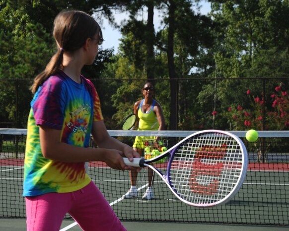 Marissa Sanders readies her tennis racket for a swing during a weeklong tennis camp hosted by the Youth Programs Center on Joint Base Charleston, S.C., July 23, 2010. Future iterations of the camp are scheduled to be held through the school year during the evening for children ages 6 and older. Marissa is the daughter of Lt. Col. Richard Sanders, 628th Civil Engineer Squadron commander. (U.S. Air Force photo/Airman 1st Class Lauren Main)