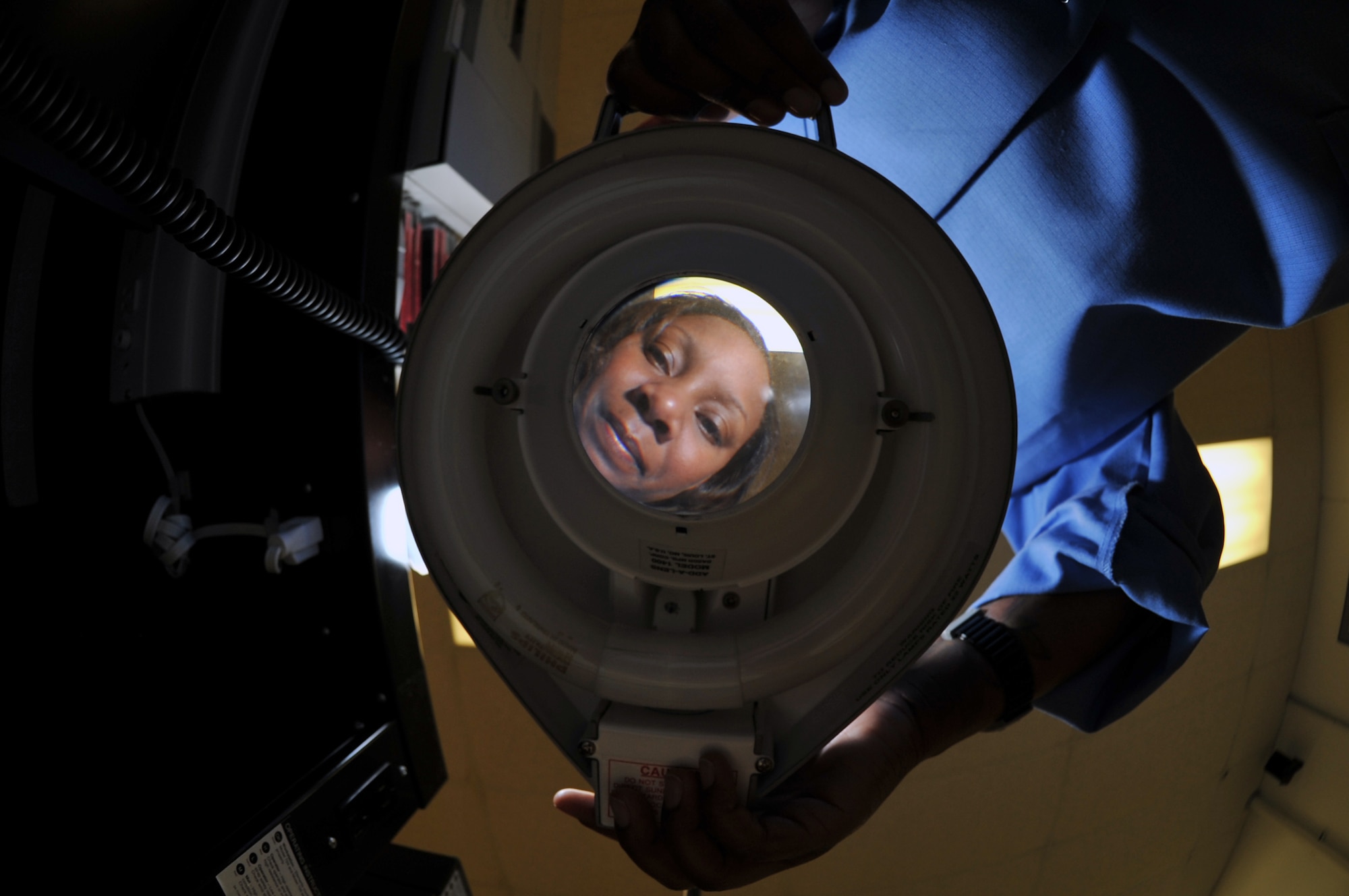 WHITEMAN AIR FORCE BASE, Mo. - Staff Sgt. Donnecha Blackmon, 509th Maintenance Group, Air Force Repair Enhancement Program lead circuit card repair technician, looks through a magnifying glass used repair circuit cards, July 21. Sergeant Stewart recently repaired an interface card and saved the Air Force $370,000 allowing uninterrupted avionics interface testing. (U.S. Air Force photo/Tech. Sgt. Charles D. Larkin Sr.)  (Released).                                            