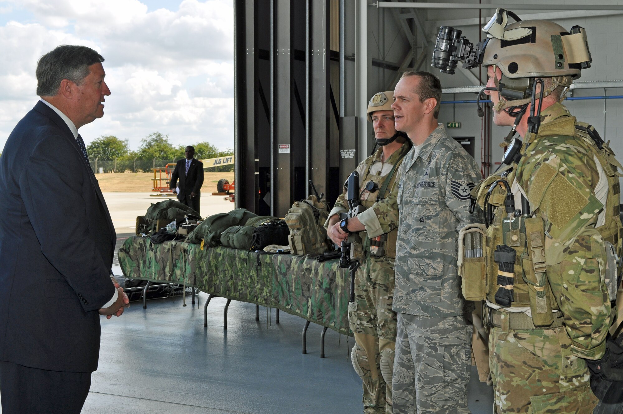 RAF MILDENHALL, England - A technical sergeant from the 321st Special Tactics Squadron explains his squadron?s unique capabilities to Secretary of the Air Force Michael Donley .   The combat controllers, special operations weathermen,  and pararescuemen of the 321st STS frequently deploy to build partner nation capacity and in support of Overseas Contingency Operations.  (U.S. Air Force photo by Tech. Sgt. Marelise Wood) 