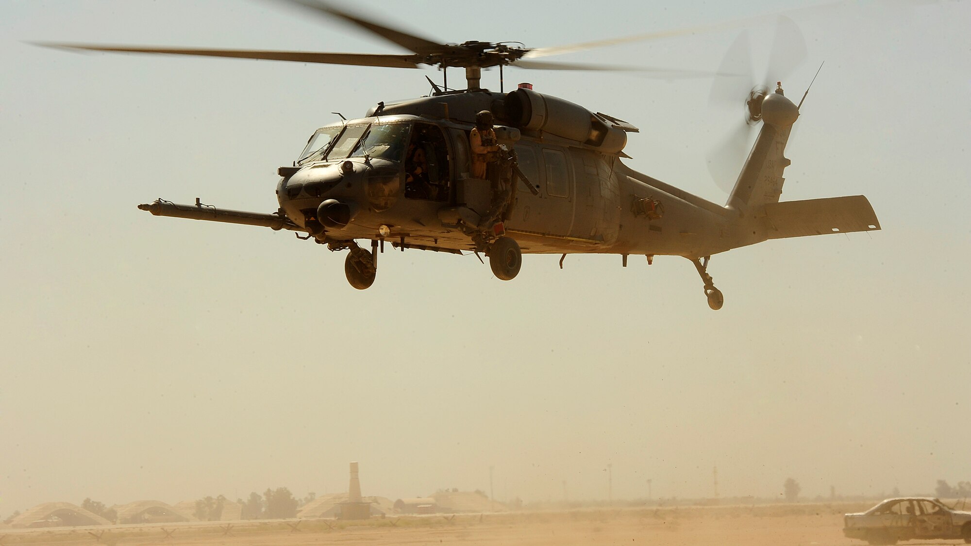 U.S. Air Force 1st Lt. Richard Scott, an HH-60G PaveHawk pilot assigned to the 64th Expeditionary Rescue Squadron, performs combat landings and takeoffs during a flying mission at Joint Base Balad, Iraq, July 12, 2010. (U.S. Air Force photo by Staff Sgt. Andy M. Kin / Released)