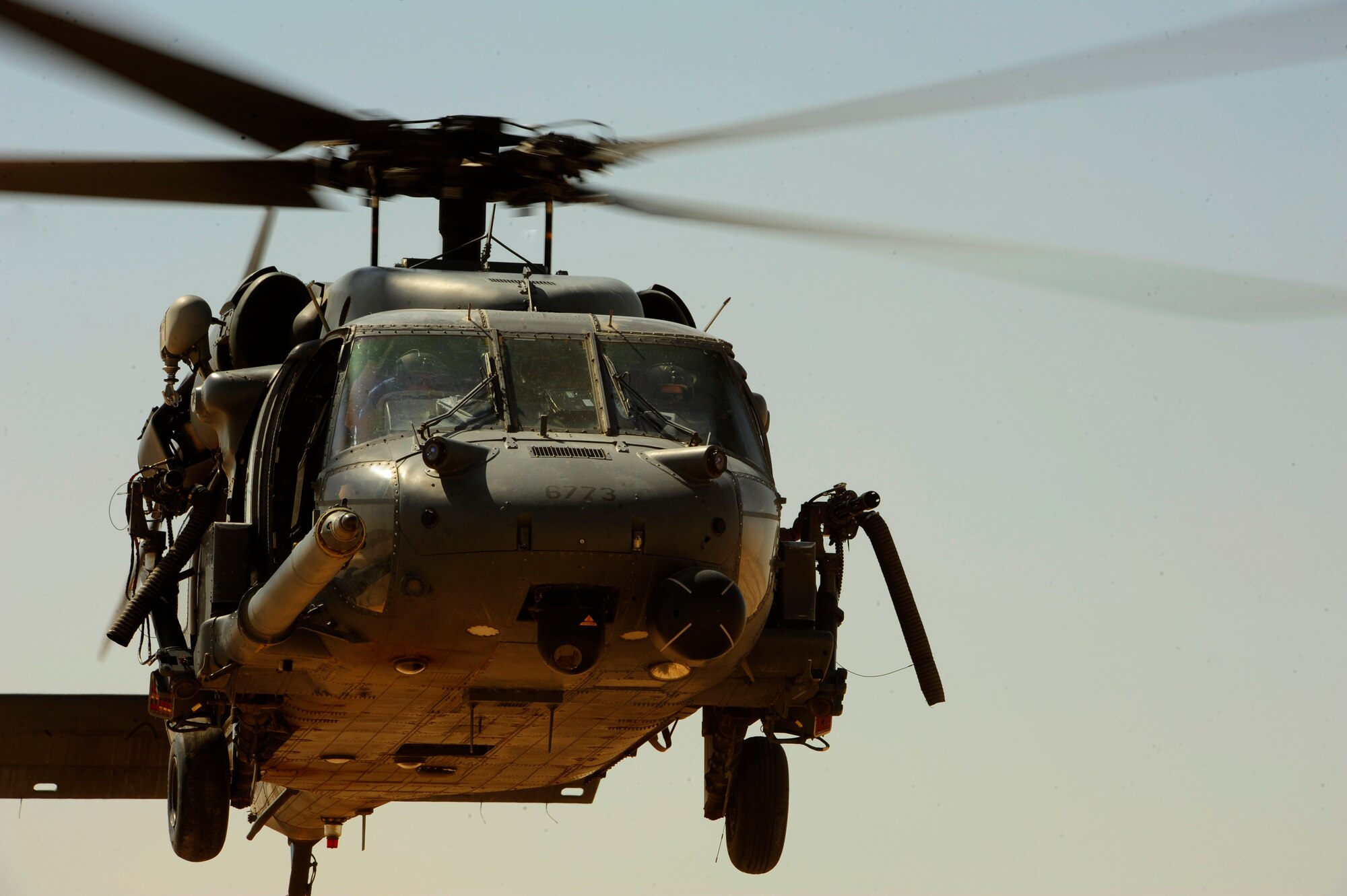 A U.S. Air Force HH-60G PaveHawk helicopter assigned to the 64th Expeditionary Rescue Squadron makes an approach over the landing zone, performing combat landings and take-offs during a flying mission at Joint Base Balad, Iraq, July 12, 2010. (U.S. Air Force photo by Staff Sgt. Andy M. Kin / Released)
