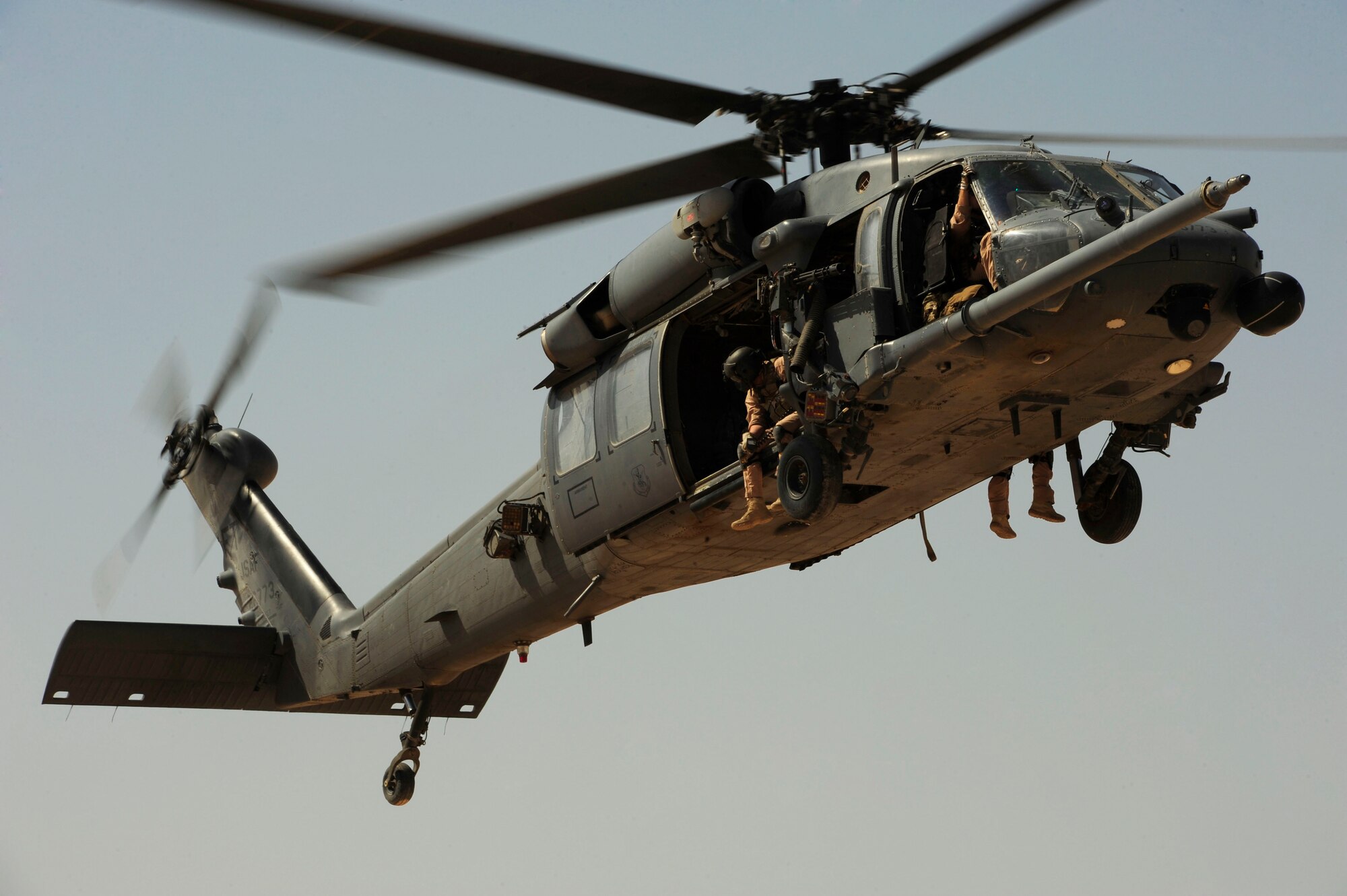 A U.S. Air Force HH-60G PaveHawk helicopter assigned to the 64th Expeditionary Rescue Squadron, flies over the landing zone during a flying mission at Joint Base Balad, Iraq, July 12, 2010. (U.S. Air Force photo by Staff Sgt. Andy M. Kin / Released)
