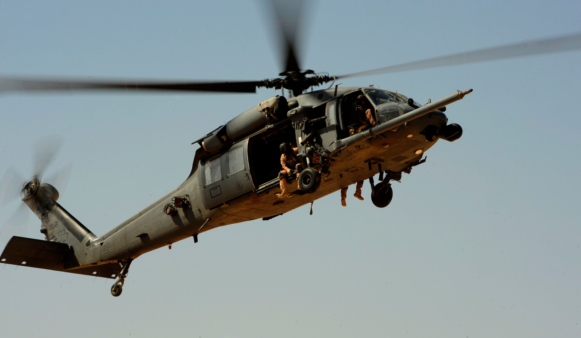 A U.S. Air Force HH-60G PaveHawk helicopter assigned to the 64th Expeditionary Rescue Squadron flies over a landing zone during a flying mission out of Joint Base Balad, Iraq, July 12, 2010. (U.S. Air Force photo by Staff Sgt. Andy M. Kin / Released)