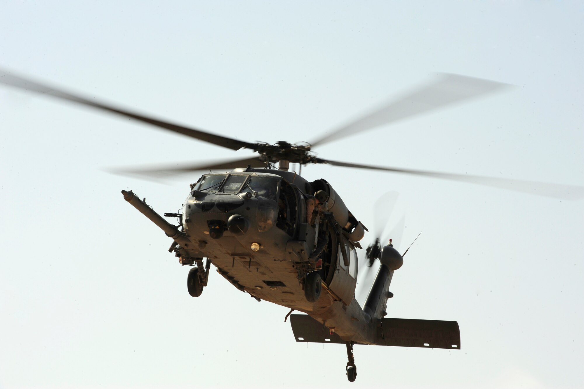A U.S. Air Force HH-60G PaveHawk helicopter assigned to the 64th Expeditionary Rescue Squadron flies over a landing zone during a mission out of Joint Base Balad, Iraq, July 12, 2010. (U.S. Air Force photo by Staff Sgt. Andy M. Kin / Released)