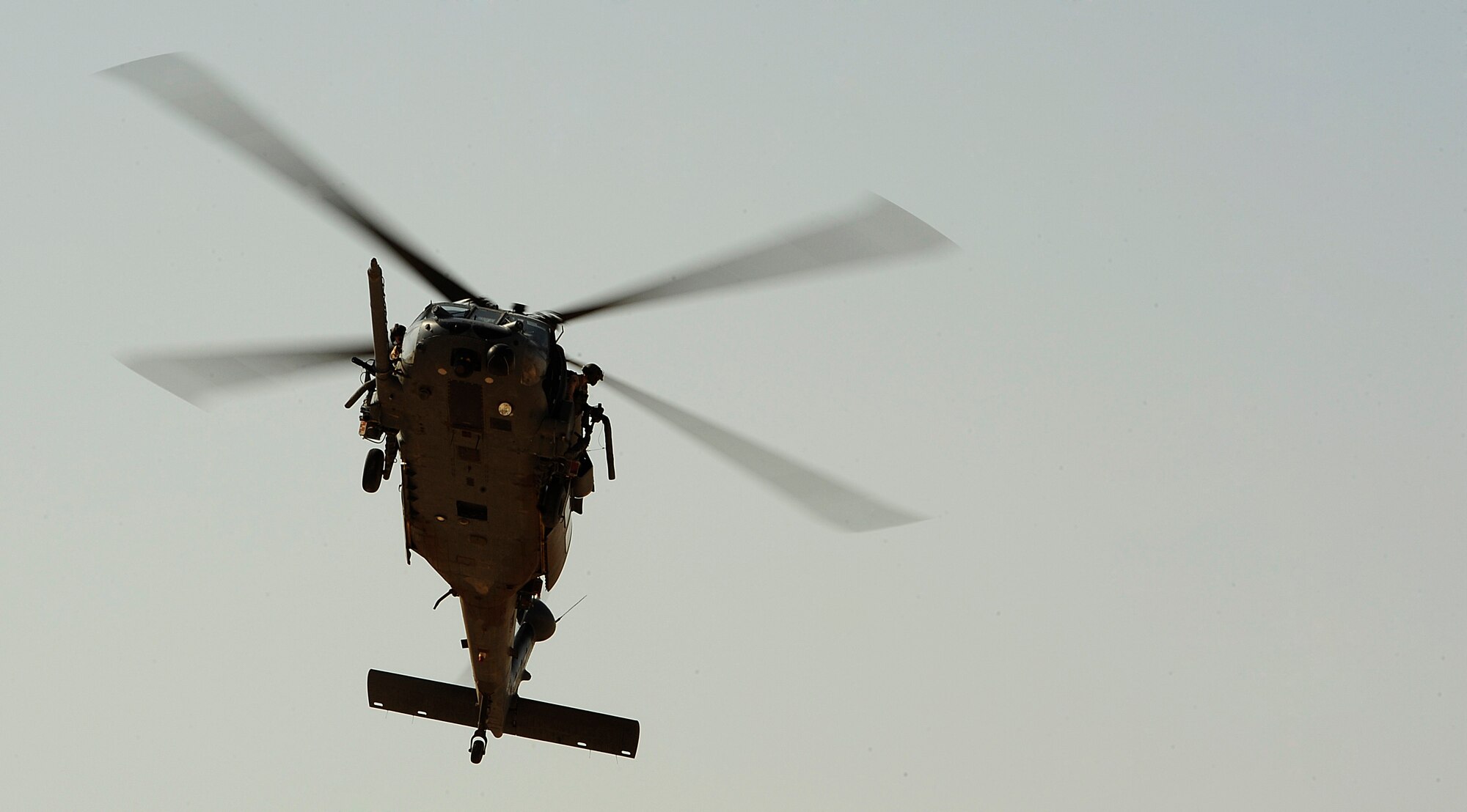 A U.S. Air Force HH-60G PaveHawk helicopter assigned to the 64th Expeditionary Rescue Squadron flies over a landing zone during a mission out of Joint Base Balad, Iraq, July 12, 2010. (U.S. Air Force photo by Staff Sgt. Andy M. Kin / Released)